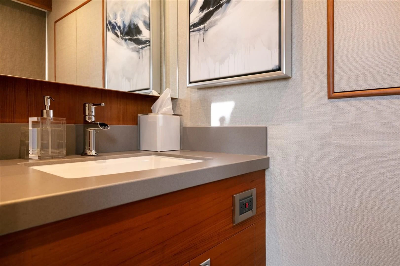 a bathroom with a sink and mirror aboard BLUE CHIP Yacht for Sale