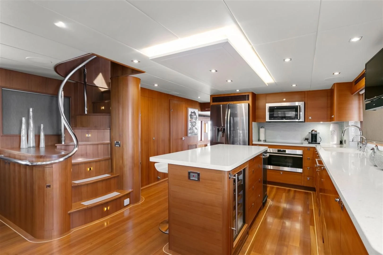 a kitchen with wooden cabinets aboard BLUE CHIP Yacht for Sale