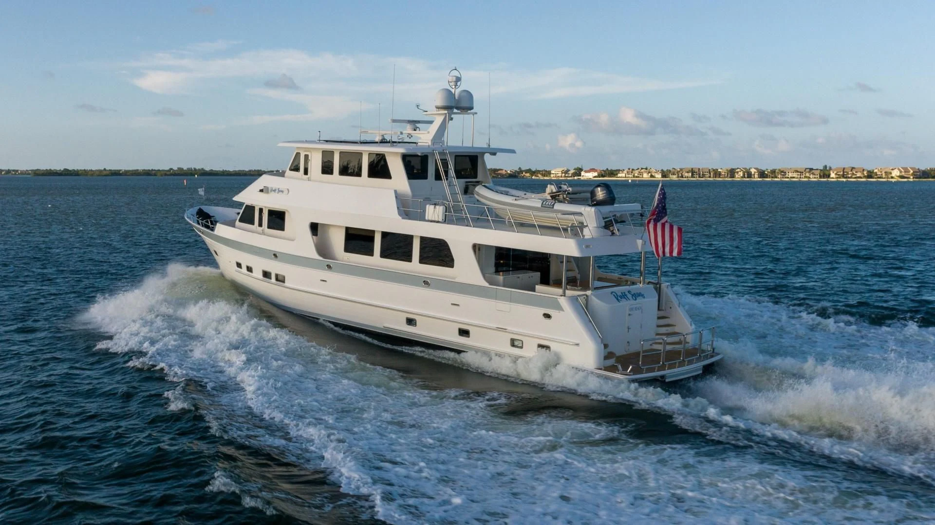 a large white boat on the water aboard BLUE CHIP Yacht for Sale