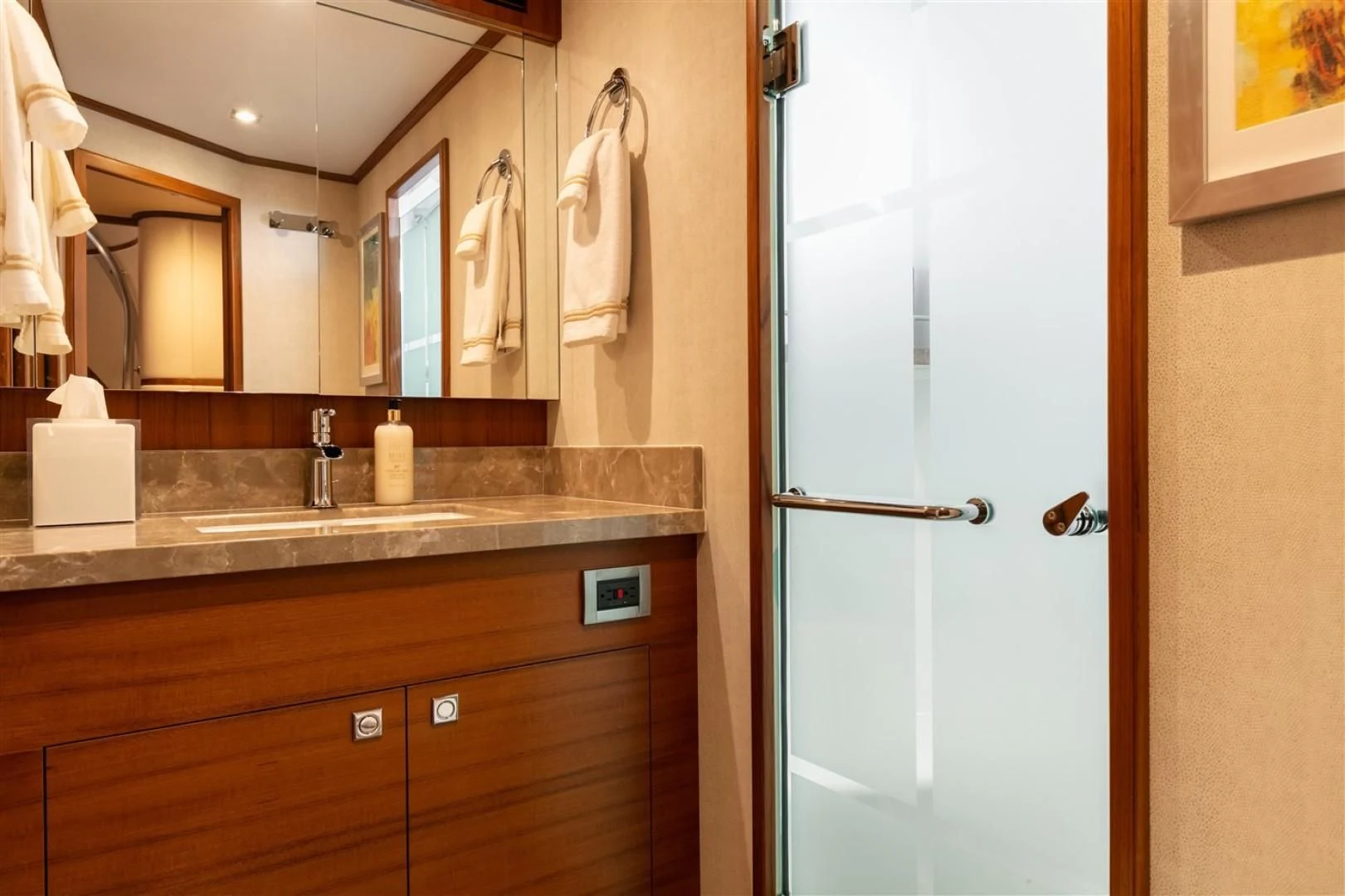a bathroom with a sink and a mirror aboard BLUE CHIP Yacht for Sale