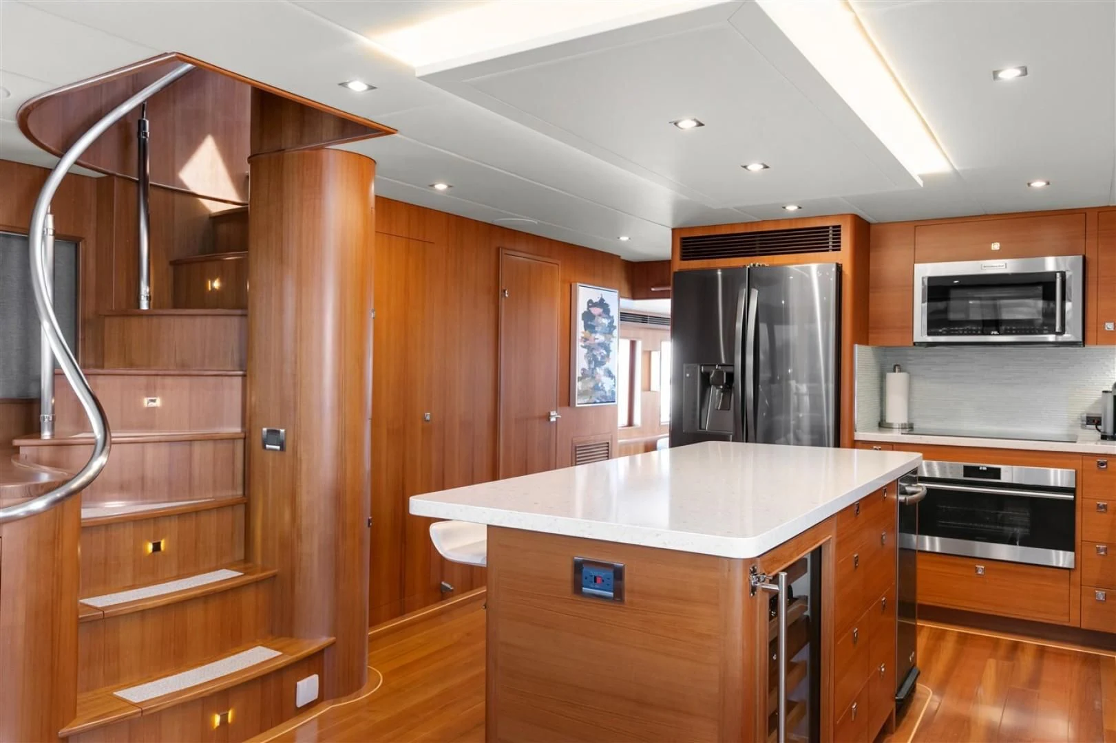 a kitchen with wooden cabinets aboard BLUE CHIP Yacht for Sale