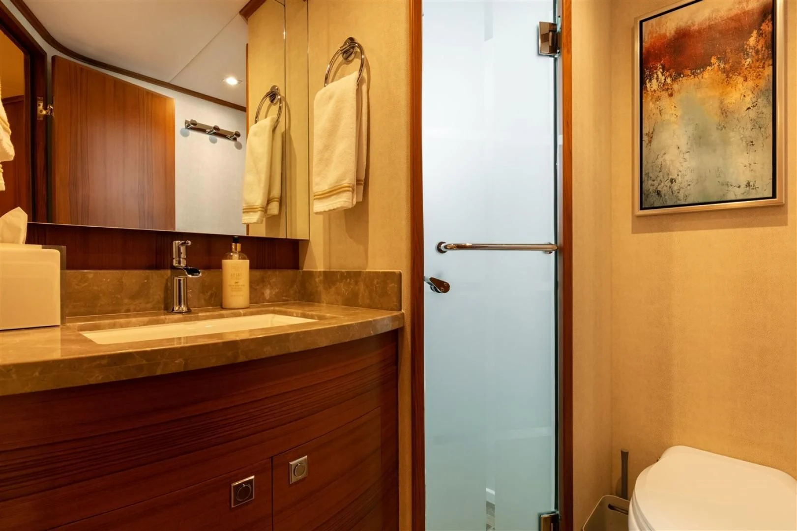 a bathroom with a sink and a mirror aboard BLUE CHIP Yacht for Sale