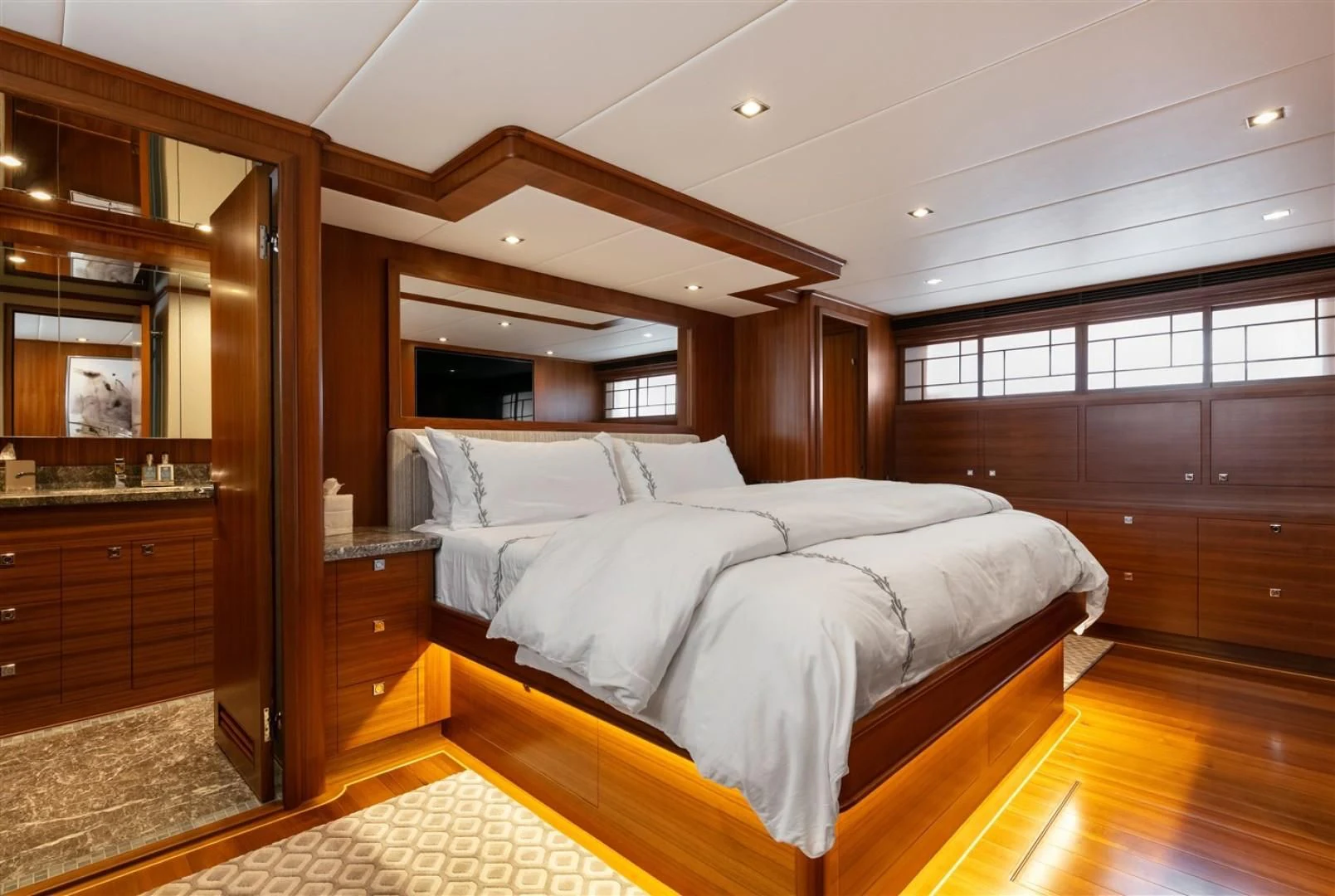 a bedroom with a large bed aboard BLUE CHIP Yacht for Sale