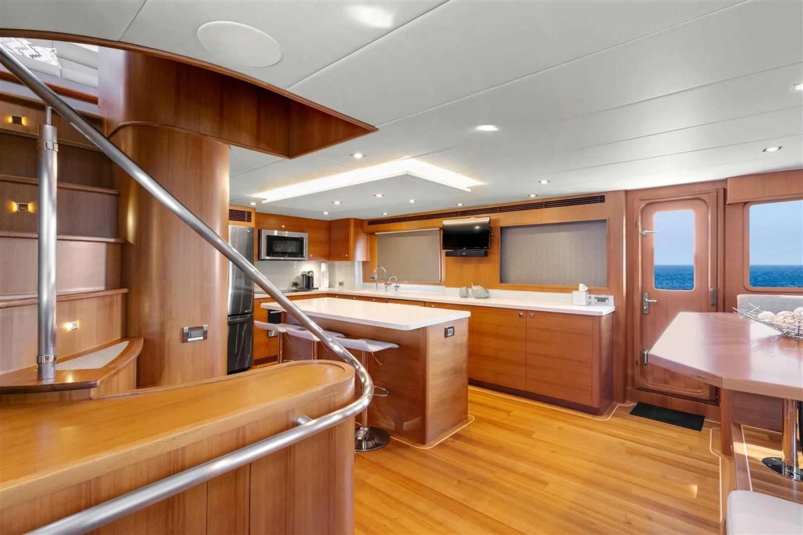 a kitchen with wooden cabinets aboard BLUE CHIP Yacht for Sale