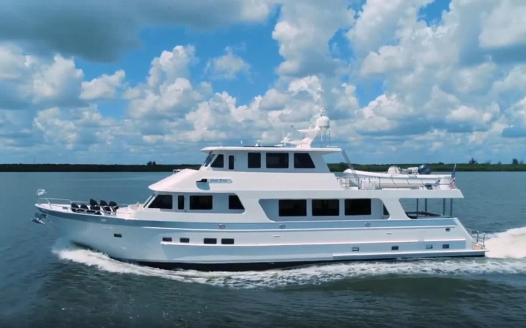 a white boat on the water aboard BLUE CHIP Yacht for Sale