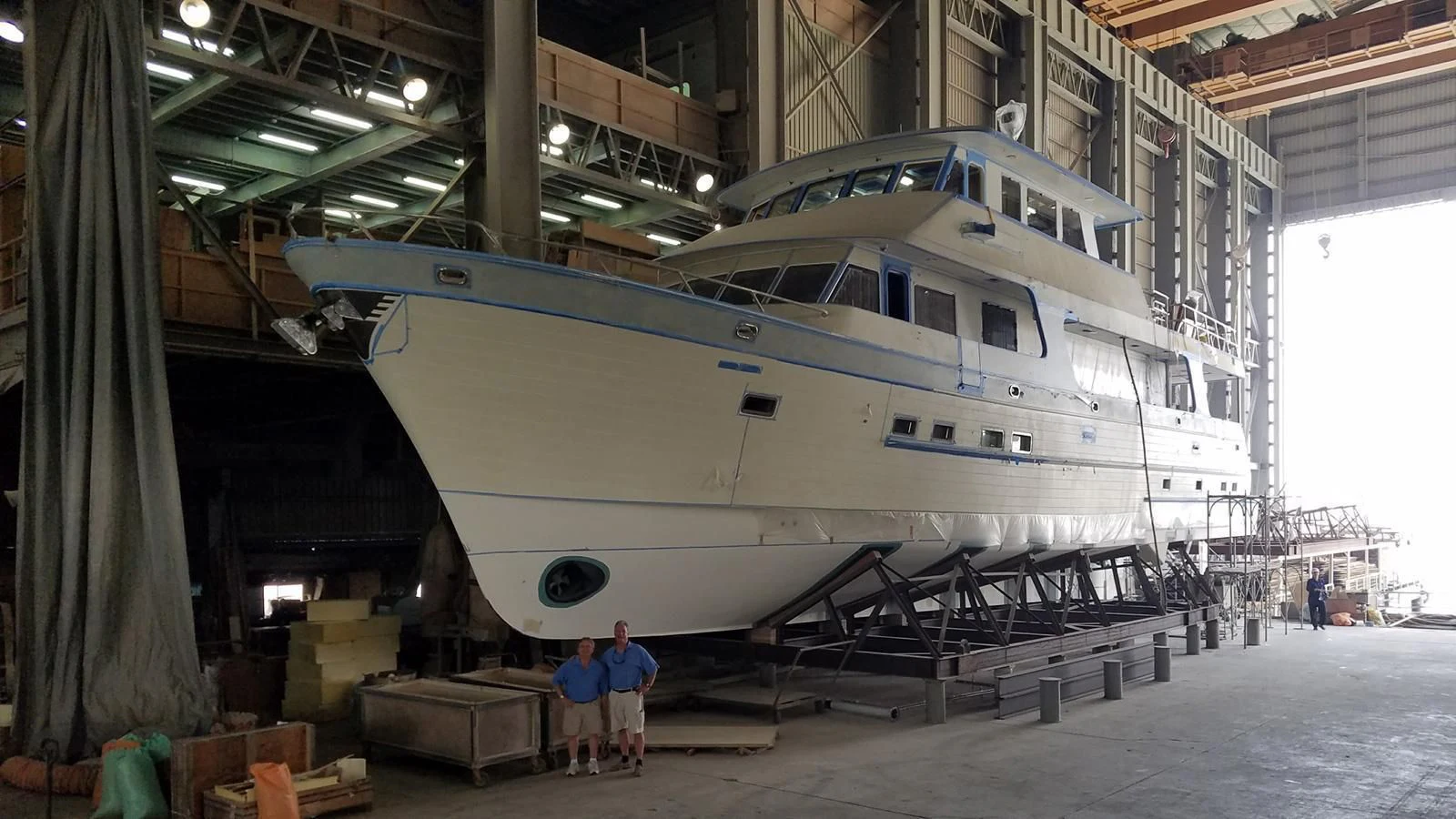 a large boat in a warehouse aboard BLUE CHIP Yacht for Sale