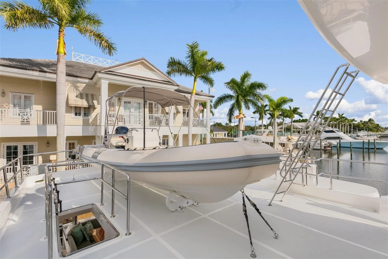a pool with a house and trees aboard BLUE CHIP Yacht for Sale