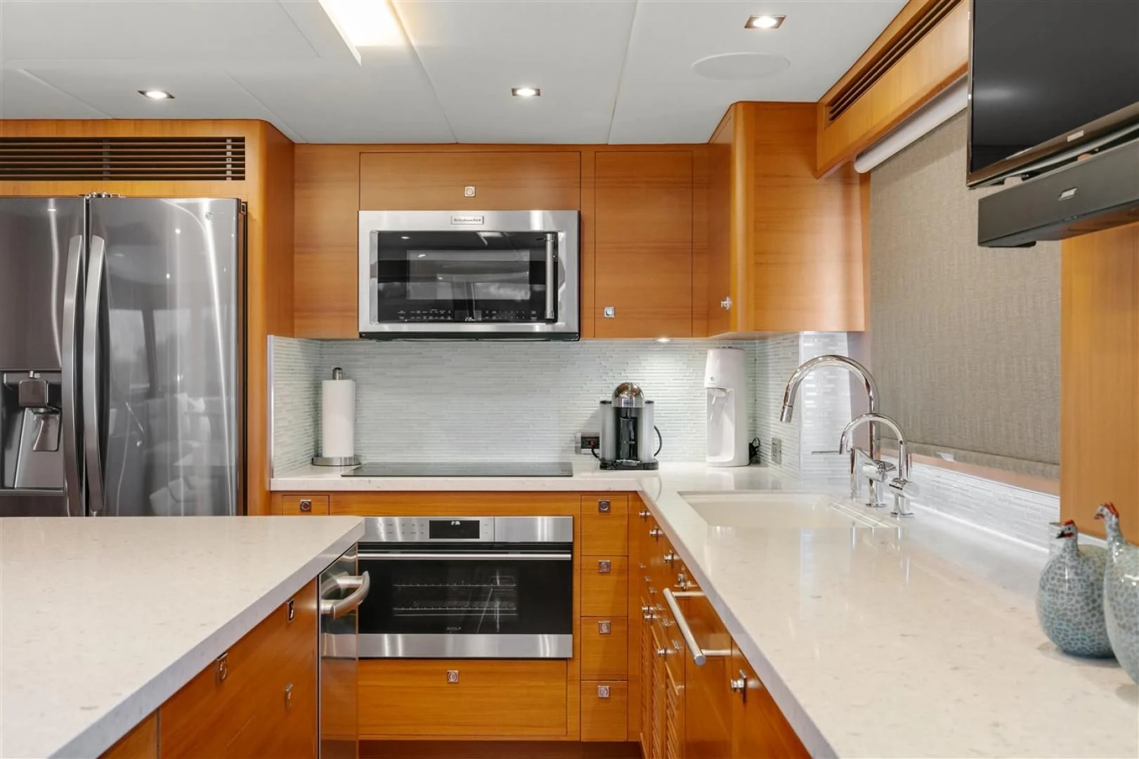 a kitchen with stainless steel appliances aboard BLUE CHIP Yacht for Sale