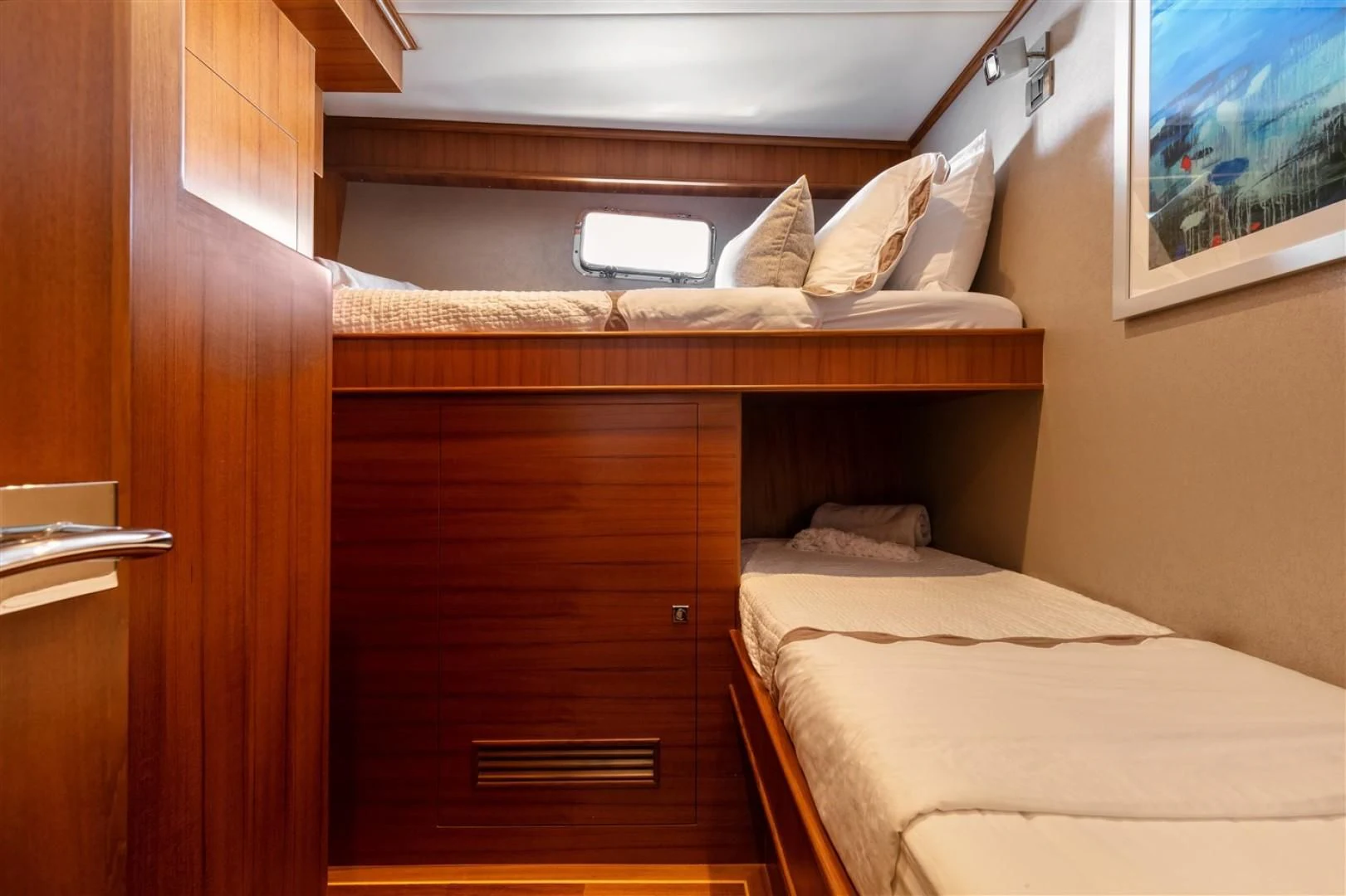 a bed with a wooden headboard aboard BLUE CHIP Yacht for Sale