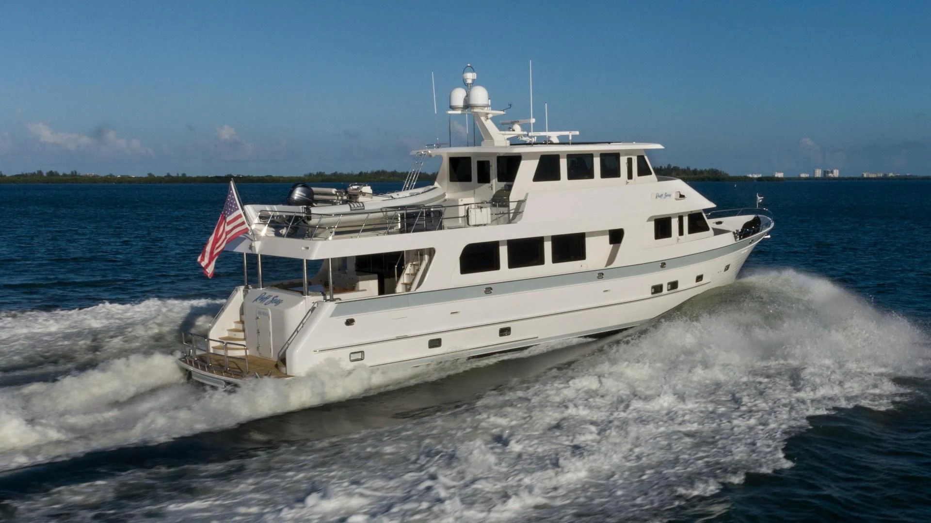 a large white boat on the water aboard BLUE CHIP Yacht for Sale