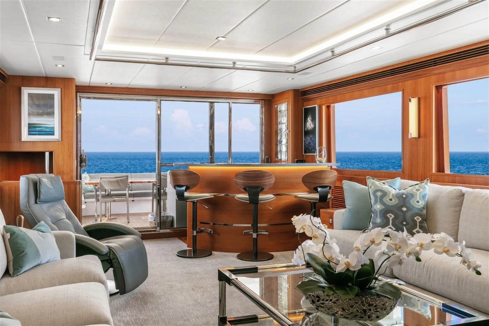 a living room with a large window aboard BLUE CHIP Yacht for Sale