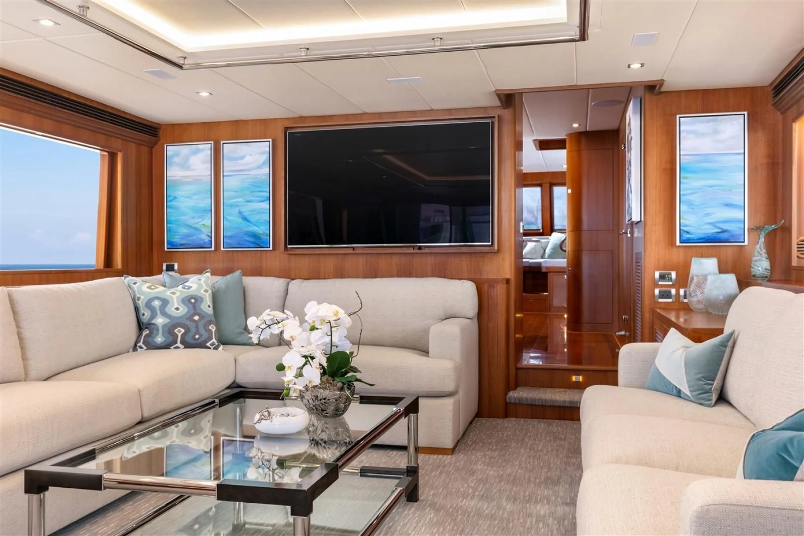 a living room with a couch and a coffee table aboard BLUE CHIP Yacht for Sale