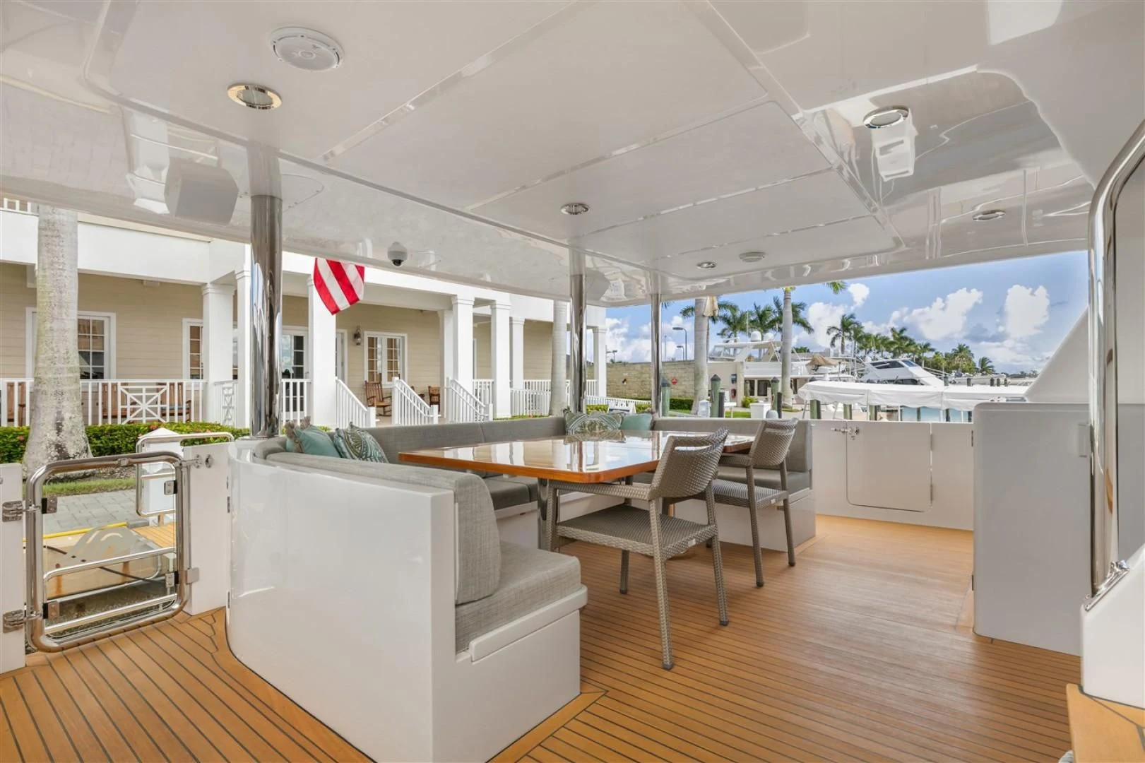 a room with a table chairs and a large window aboard BLUE CHIP Yacht for Sale