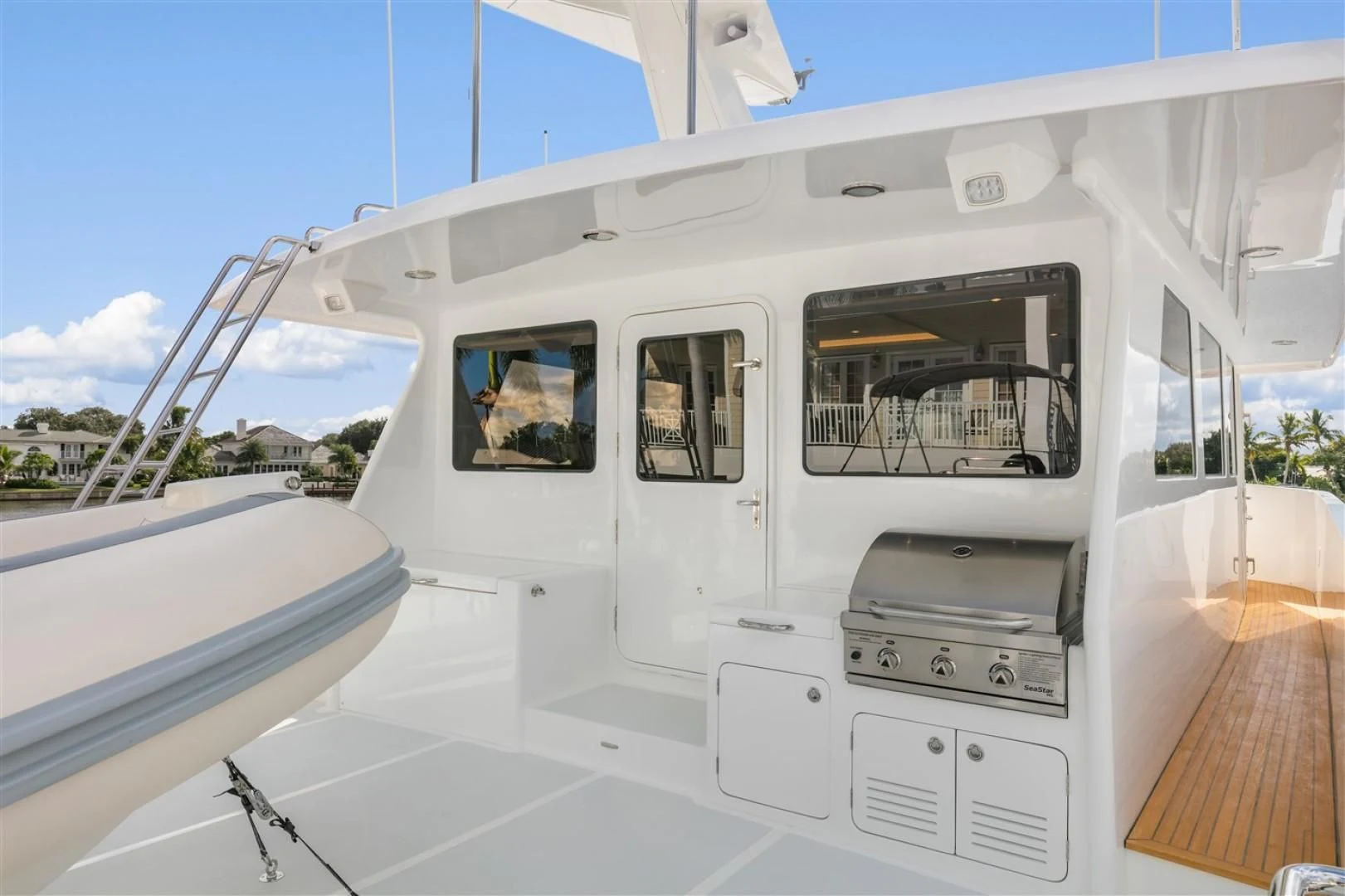 a white house with a large window aboard BLUE CHIP Yacht for Sale