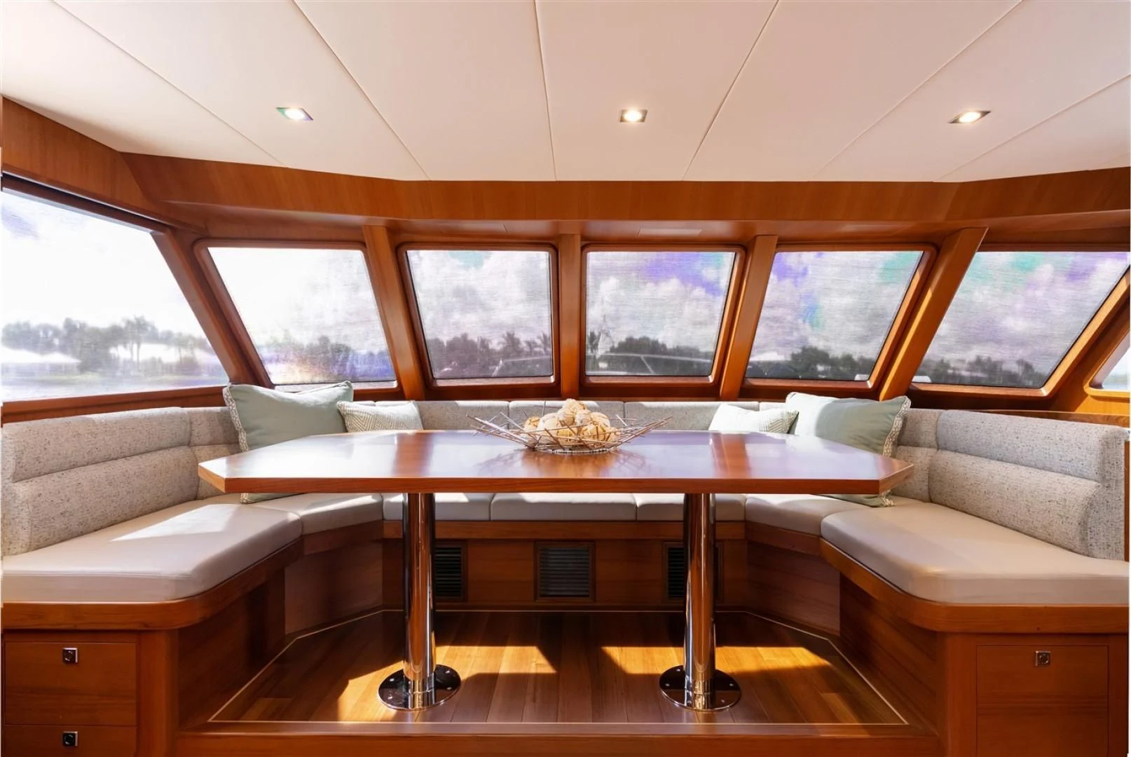 a room with a table and couch aboard BLUE CHIP Yacht for Sale