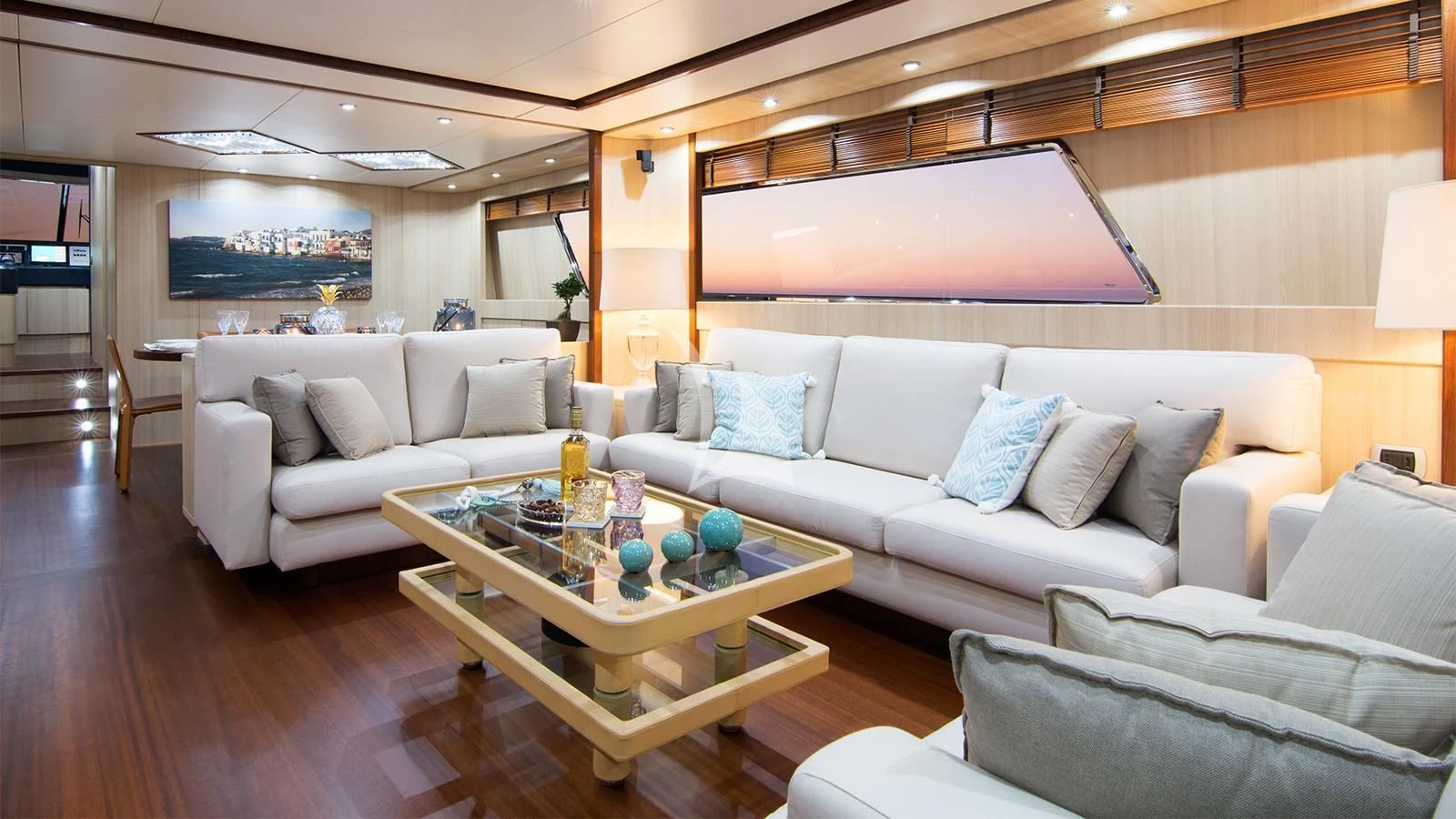 a living room with a couch and a table aboard ACIONNA Yacht for Sale