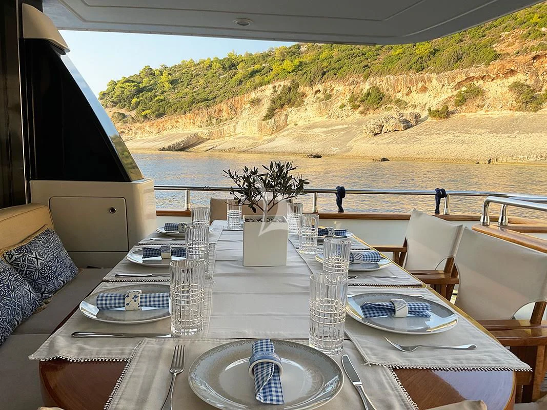 a table set for a dinner aboard ACIONNA Yacht for Sale