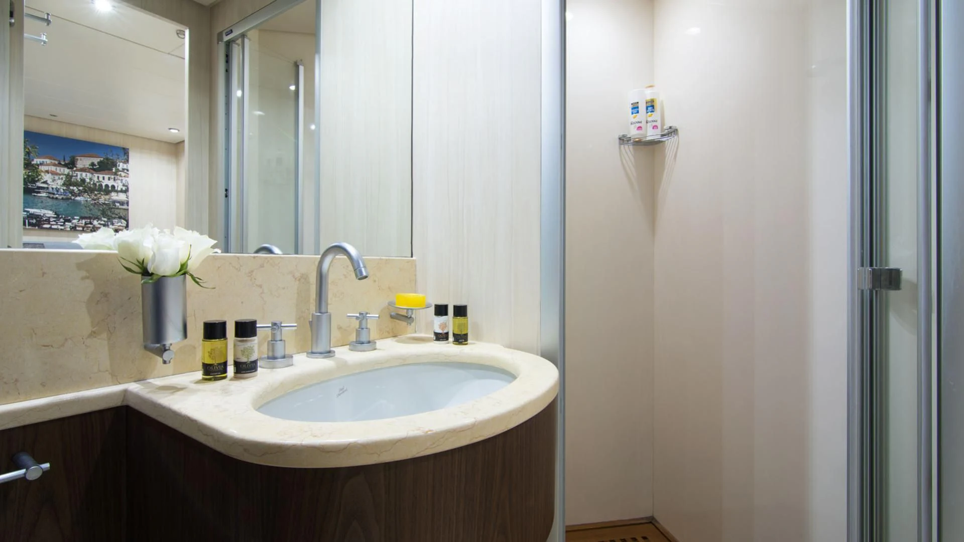 a bathroom with a sink and mirror aboard ACIONNA Yacht for Sale