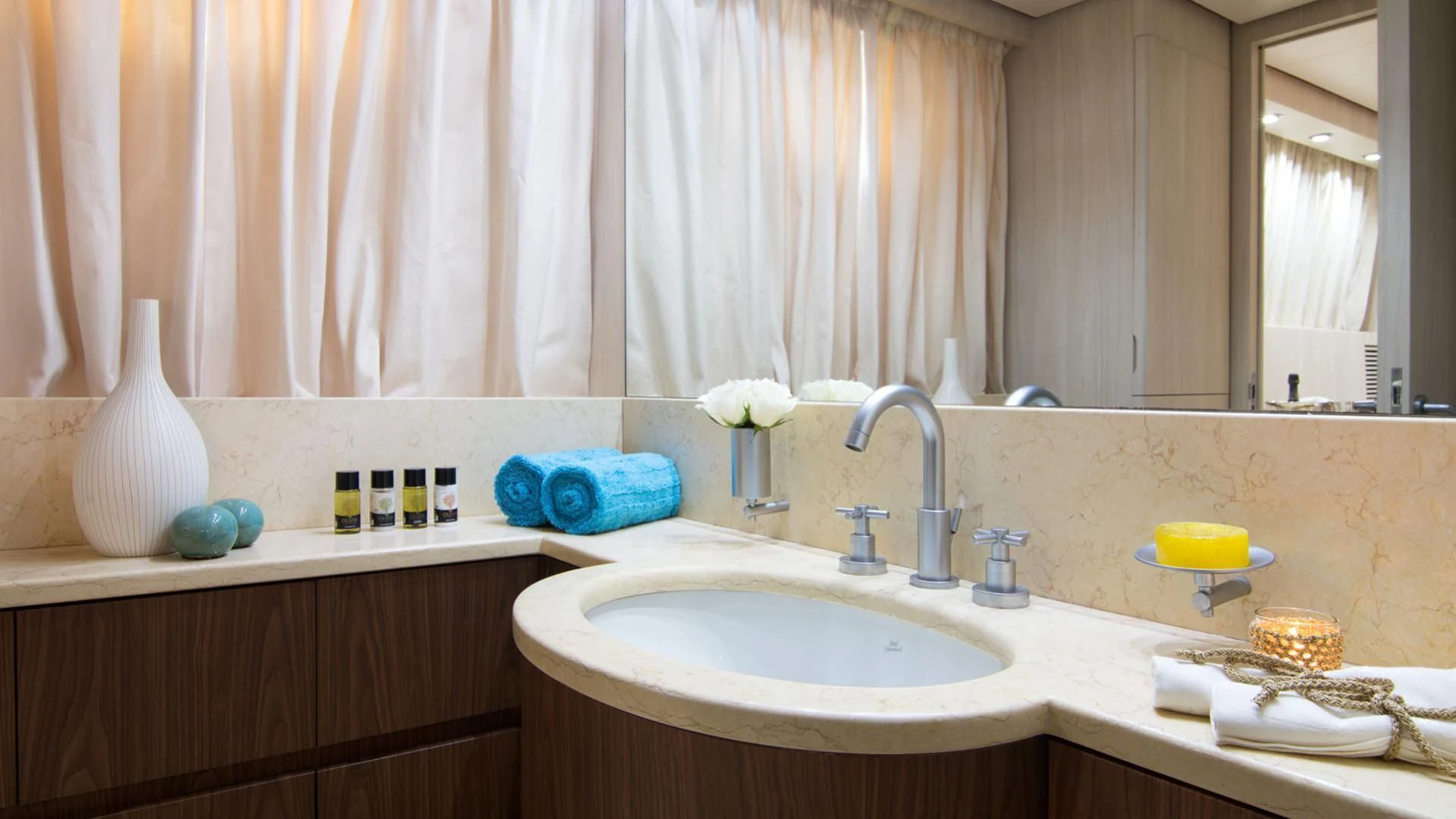 a bathroom with a sink and a mirror aboard ACIONNA Yacht for Sale