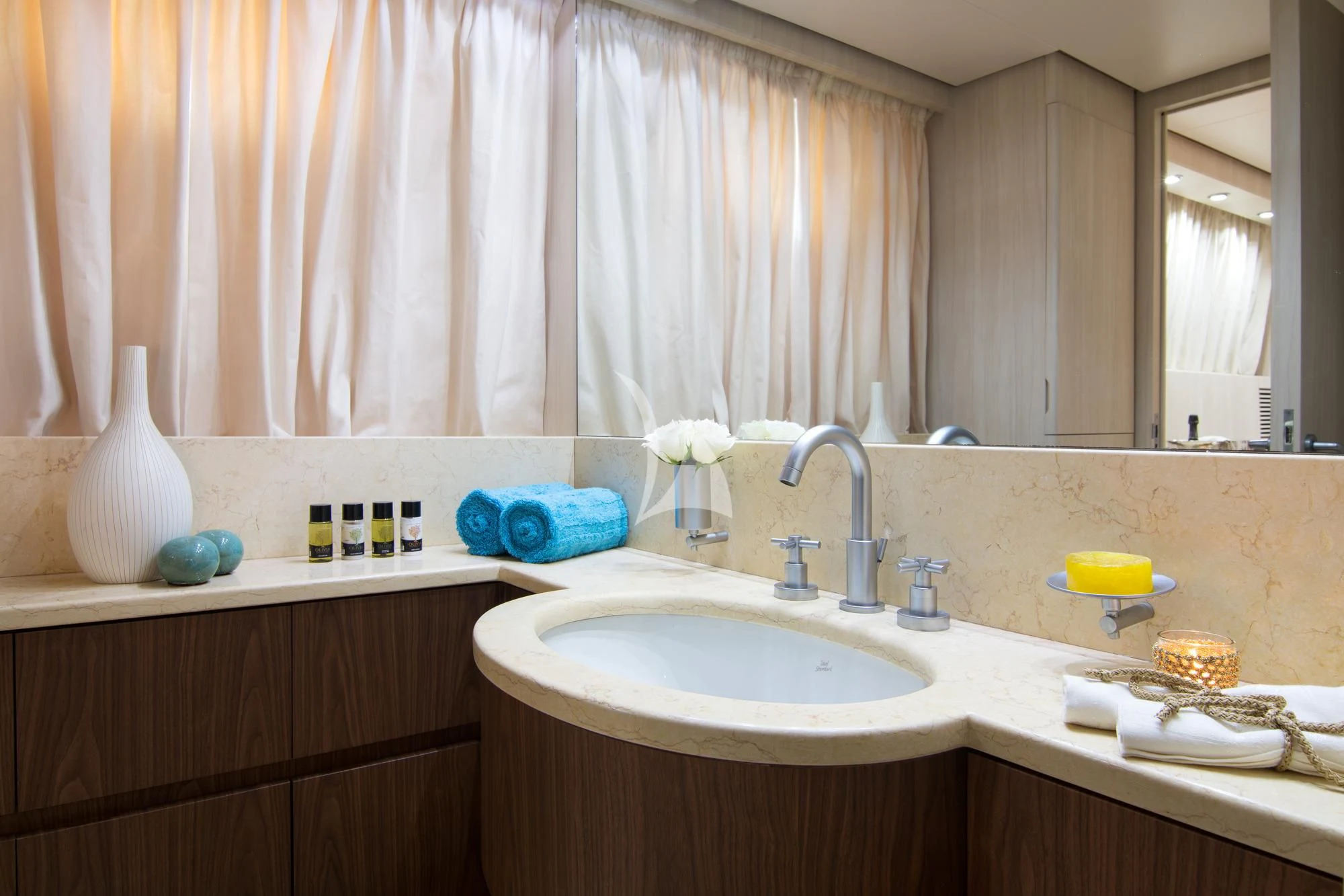 a bathroom with a sink and a mirror aboard ACIONNA Yacht for Sale