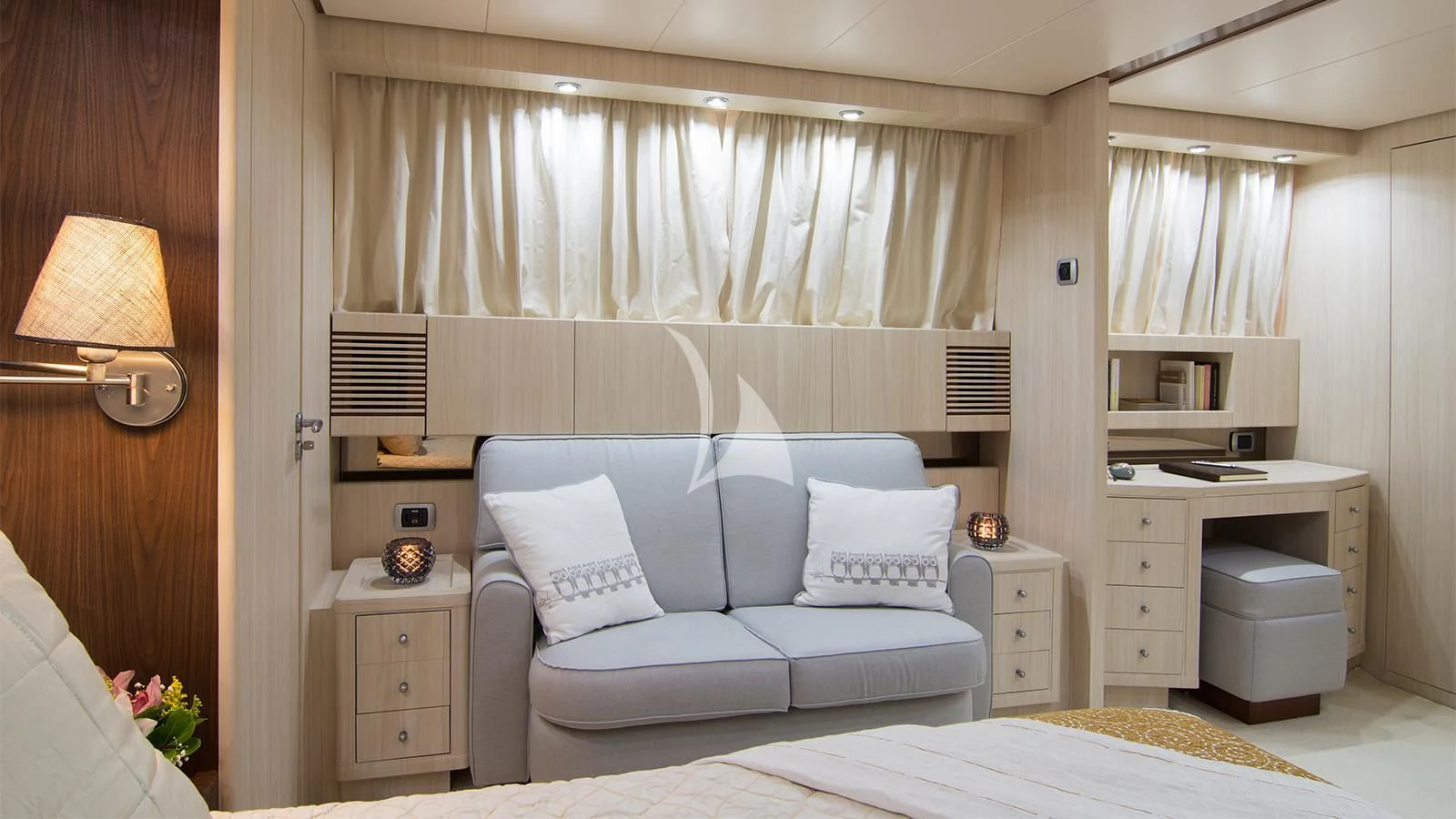 a white couch in a room aboard ACIONNA Yacht for Sale