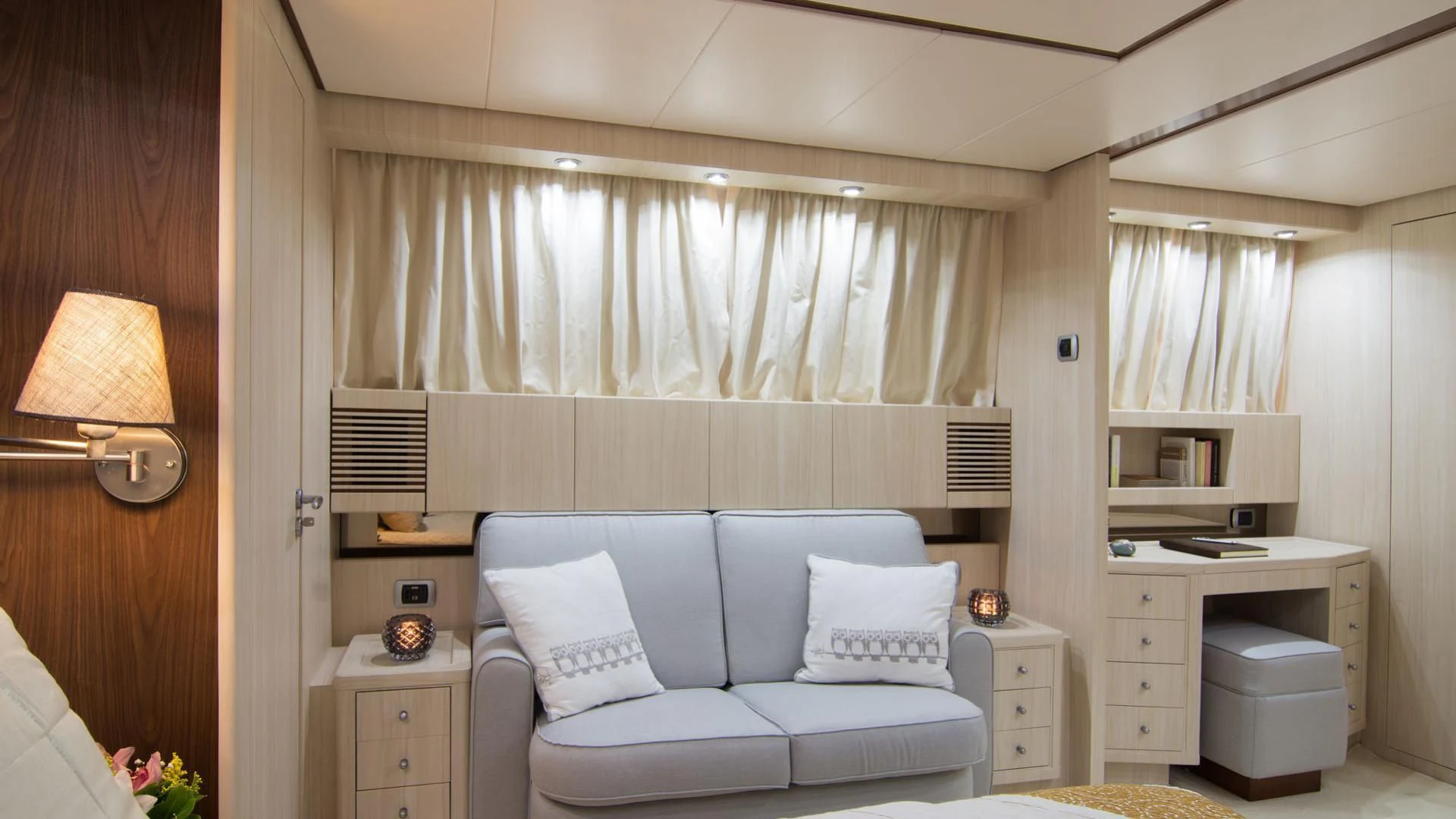 a living room with a couch and a lamp aboard ACIONNA Yacht for Sale
