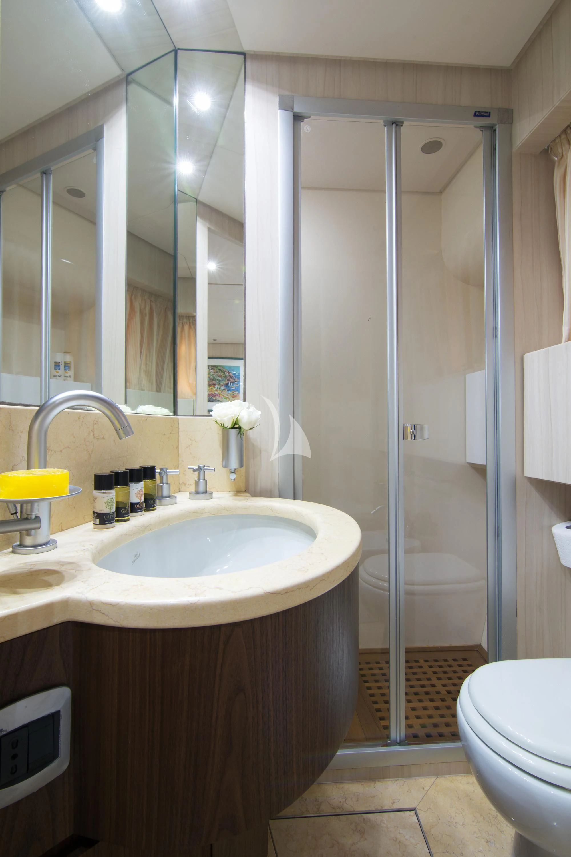 a bathroom with a shower sink and toilet aboard ACIONNA Yacht for Sale