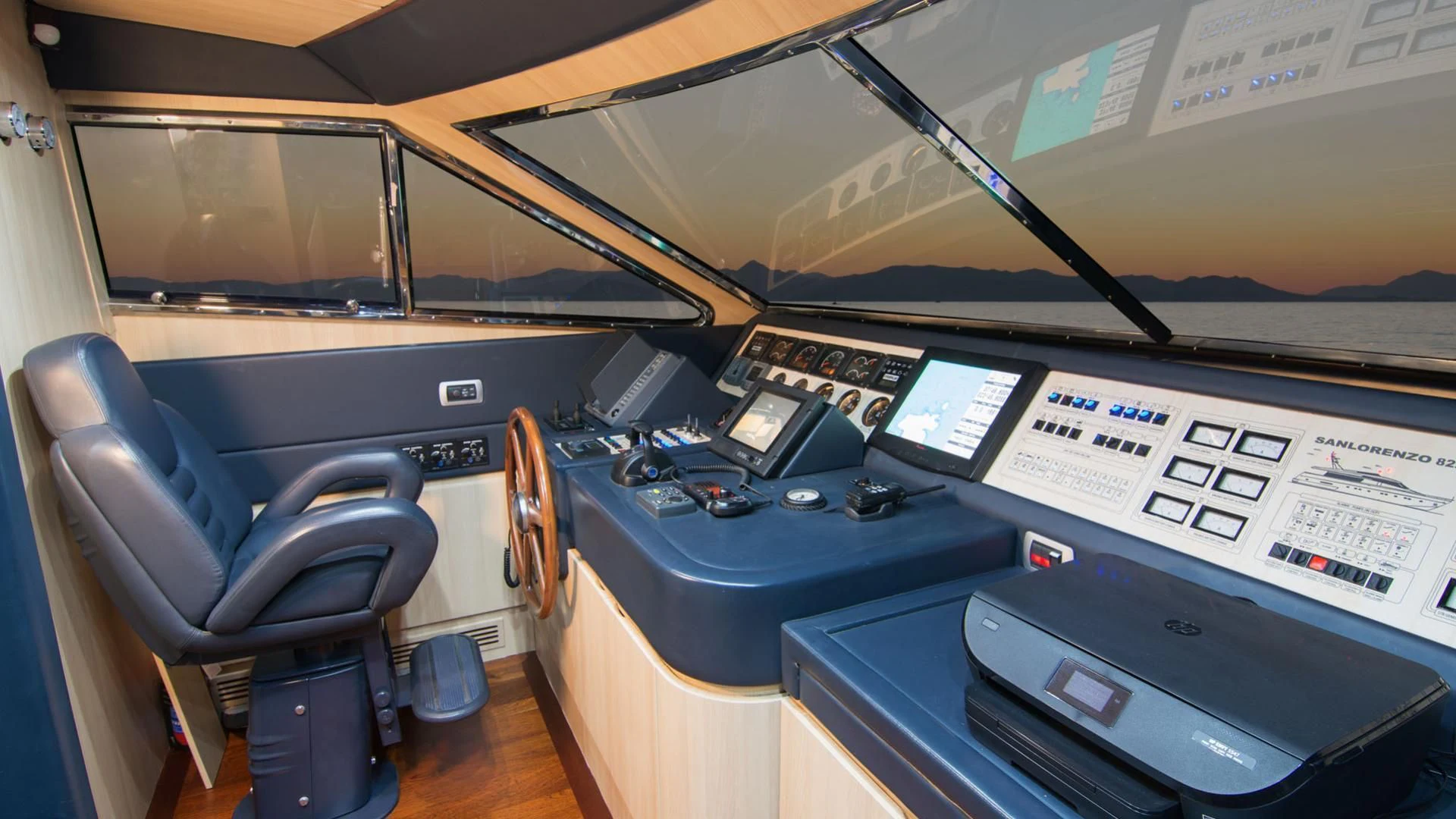 a room with computers and monitors aboard ACIONNA Yacht for Sale