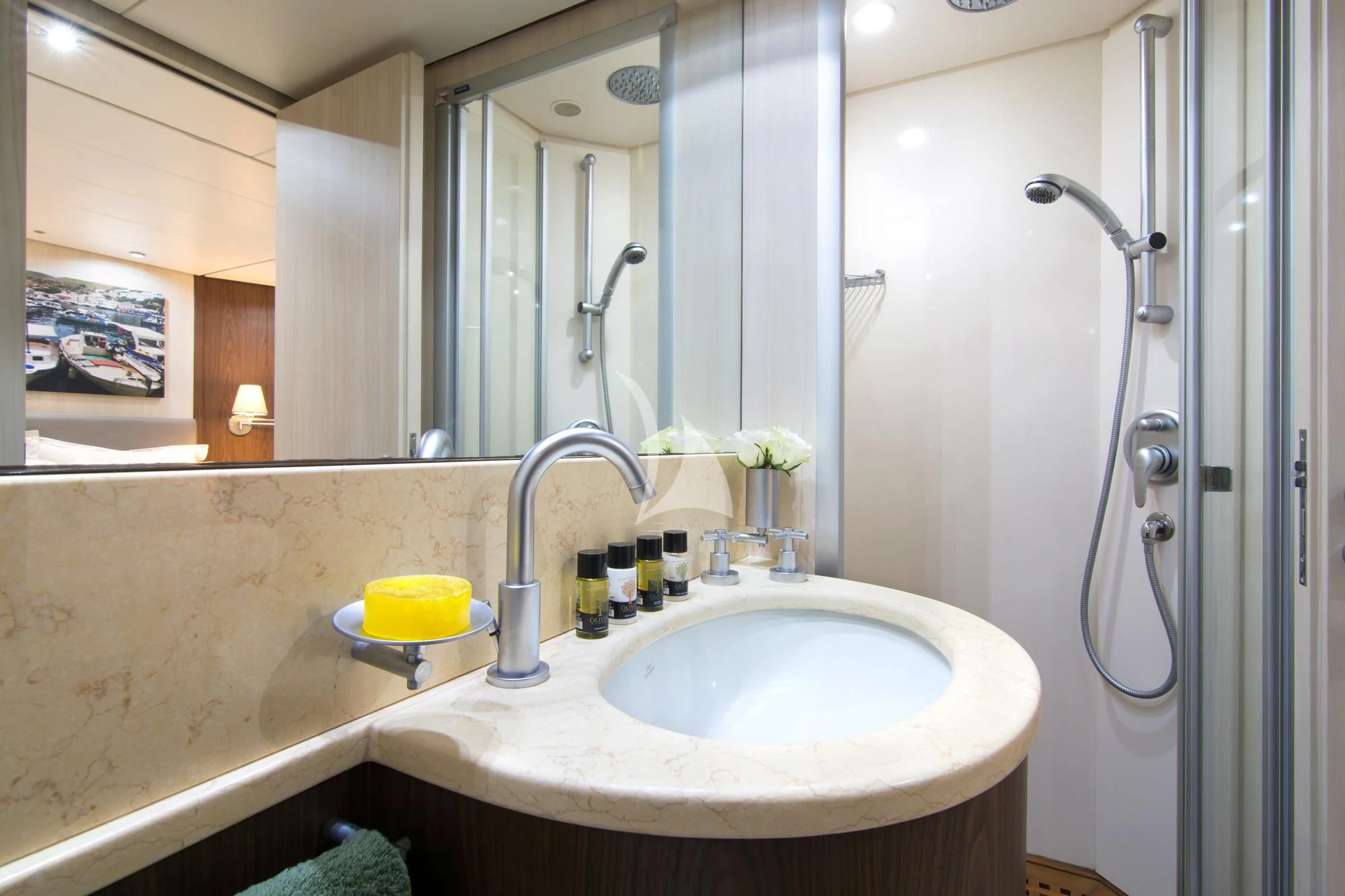 a bathroom with a sink and shower aboard ACIONNA Yacht for Sale