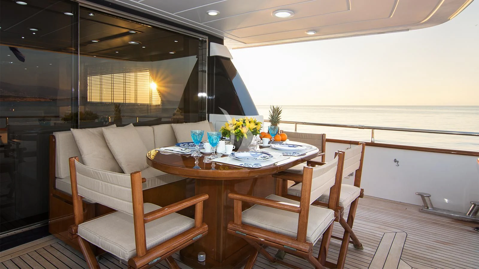 a table and chairs in a room aboard ACIONNA Yacht for Sale
