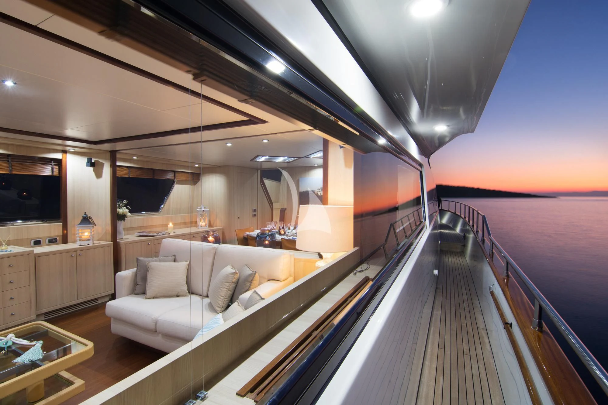 a large room with a large bed and a couch aboard ACIONNA Yacht for Sale