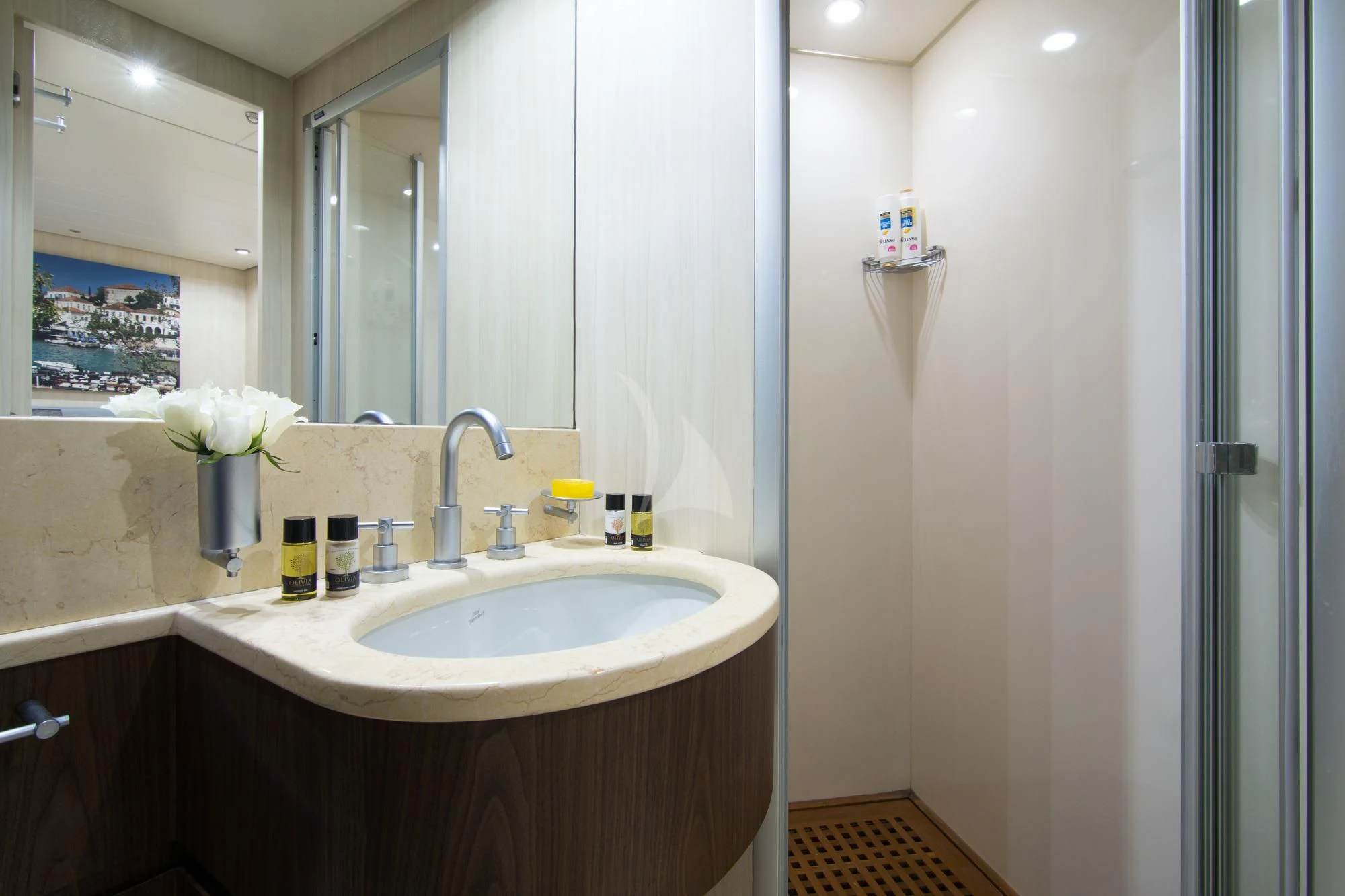 a bathroom with a sink and mirror aboard ACIONNA Yacht for Sale