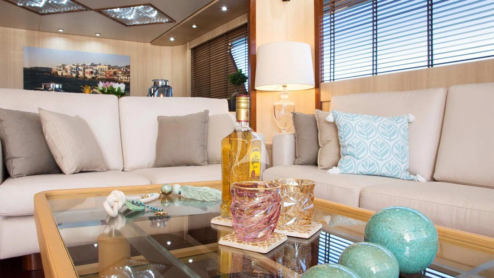 a living room with a couch and a table aboard ACIONNA Yacht for Sale