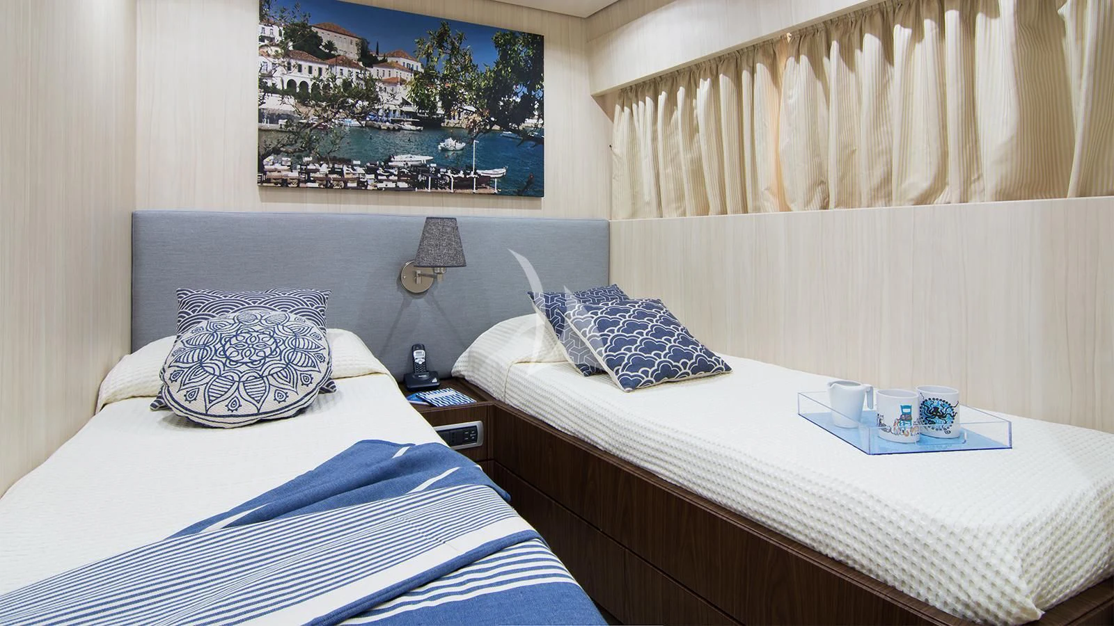 a hotel room with a bed and a picture on the wall aboard ACIONNA Yacht for Sale
