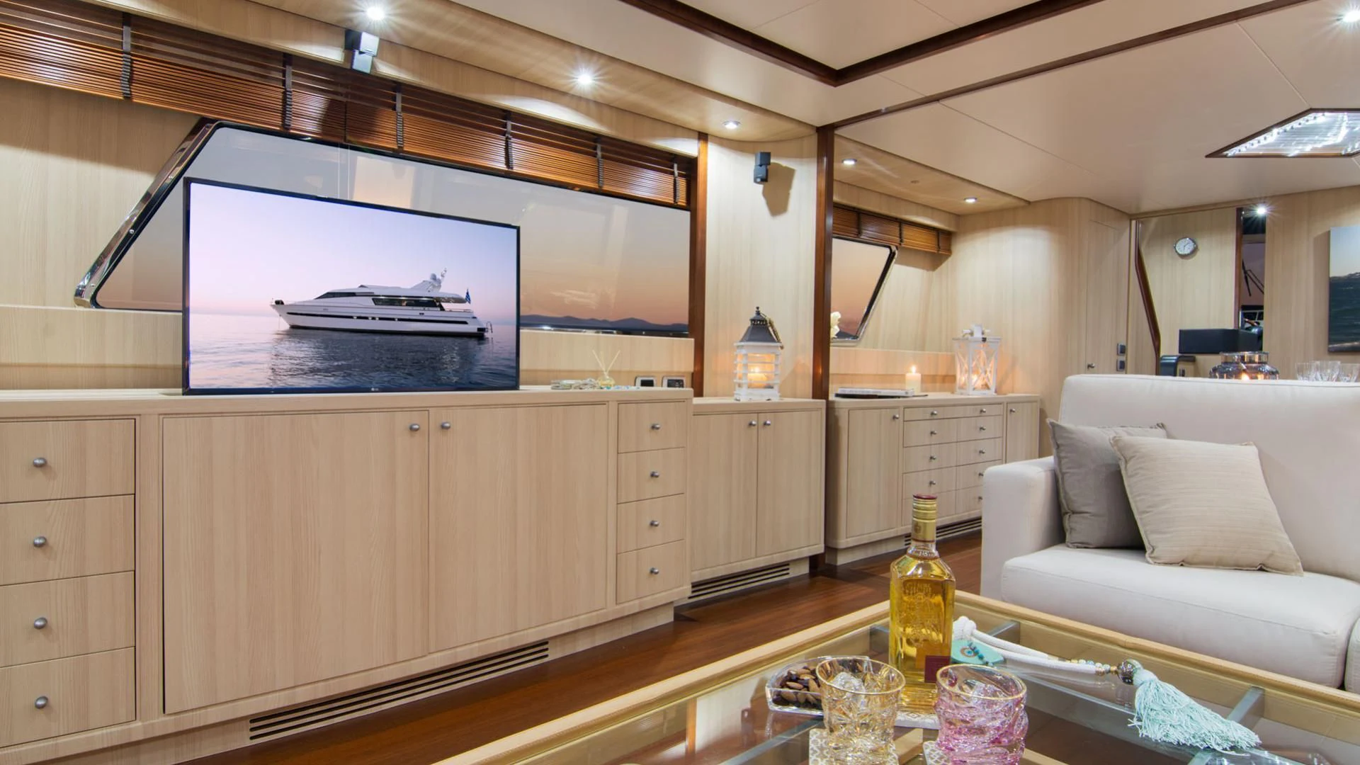 a kitchen with a large tv aboard ACIONNA Yacht for Sale