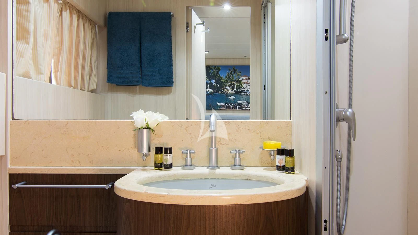 a bathroom with a sink and a mirror aboard ACIONNA Yacht for Sale