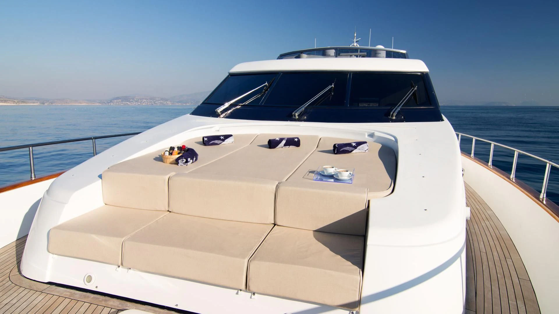 a white yacht on a deck aboard ACIONNA Yacht for Sale
