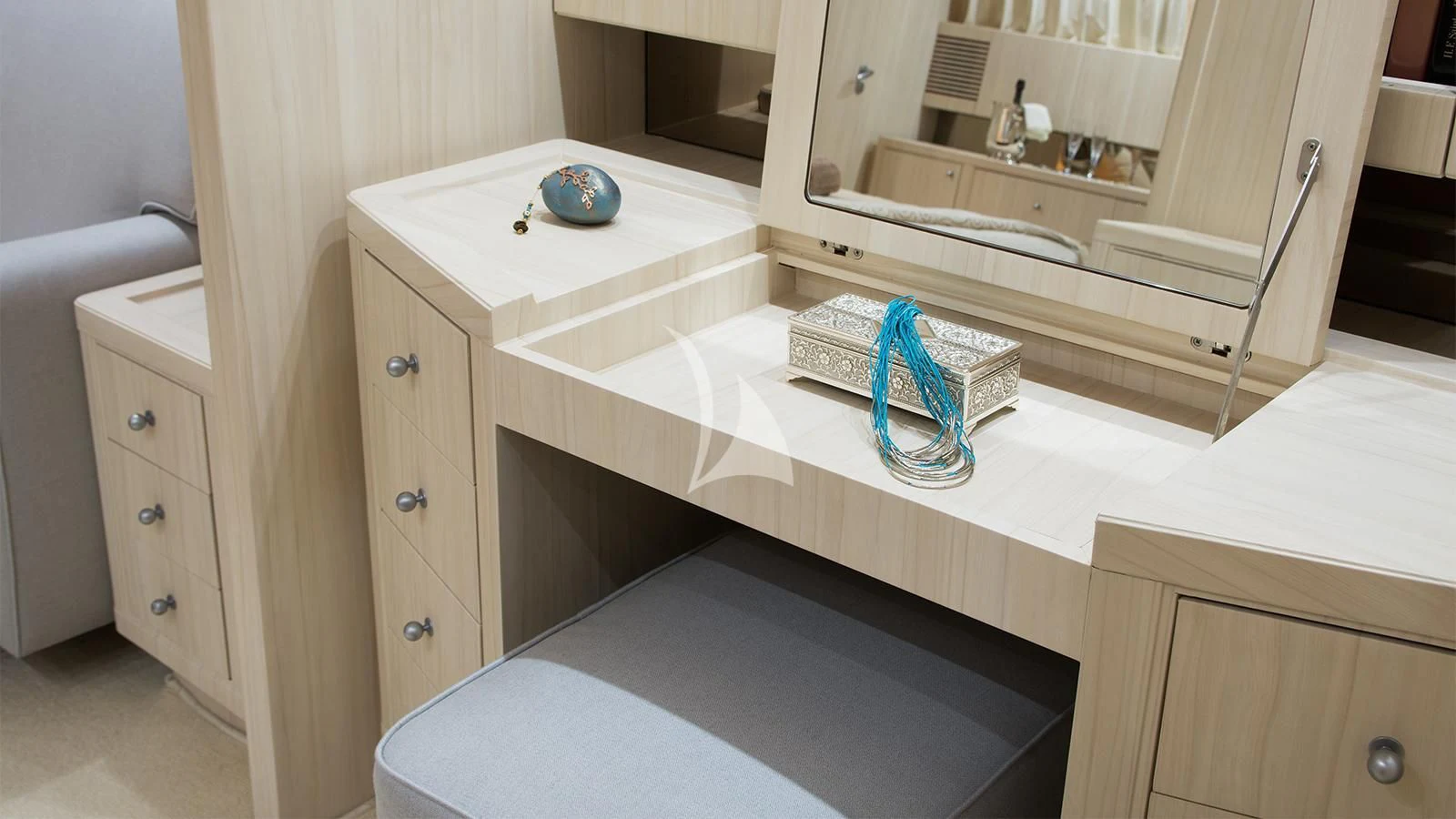 a white table with a blue ball on it aboard ACIONNA Yacht for Sale