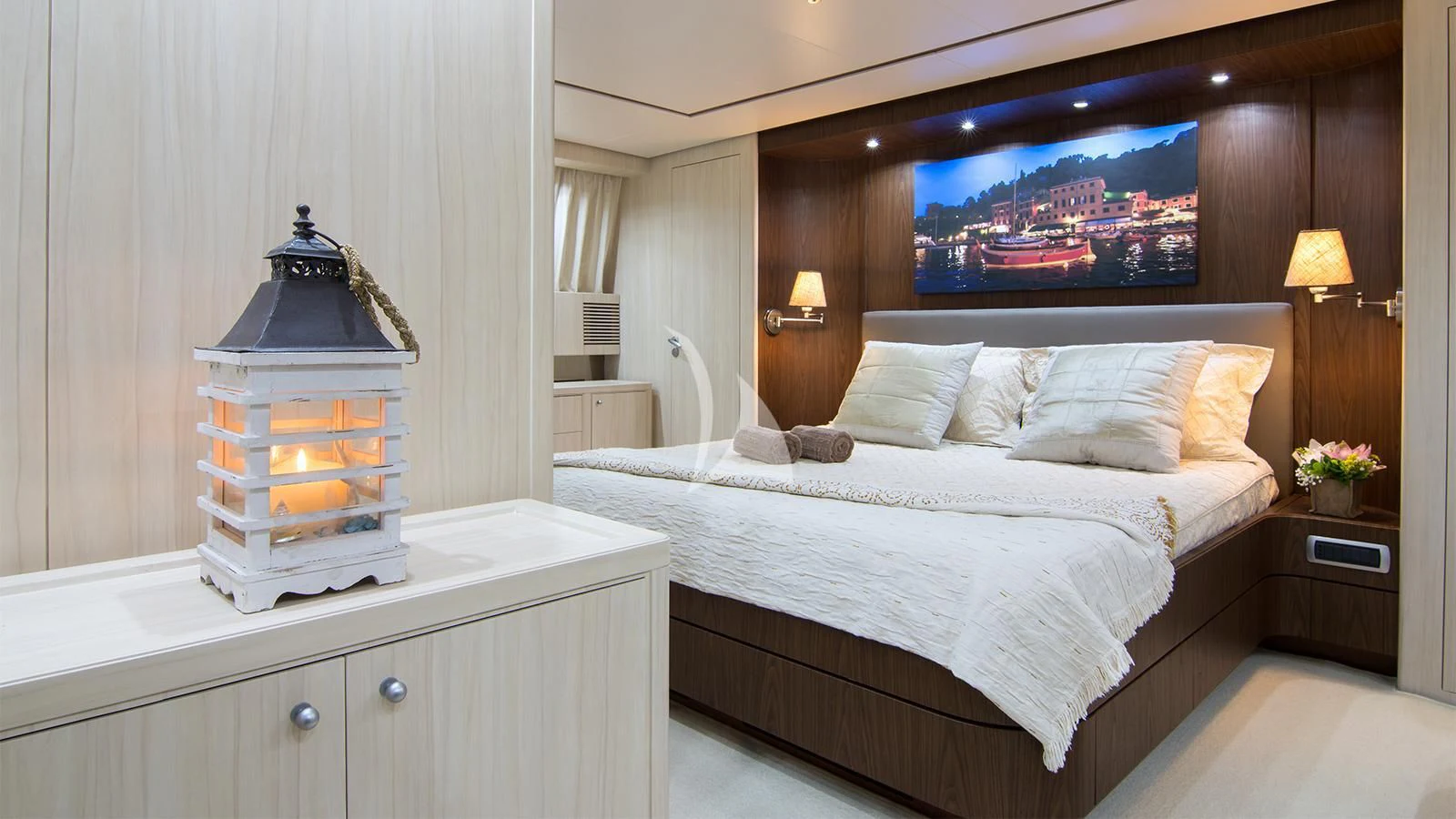 a room with a bed and a television on the wall aboard ACIONNA Yacht for Sale