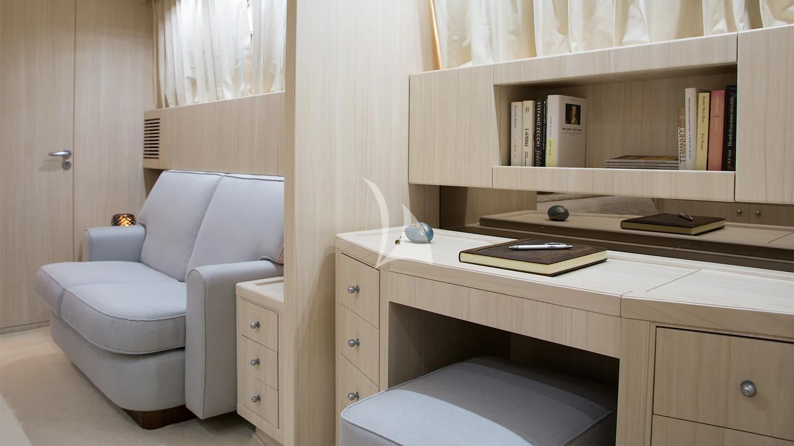 a white chair in a room aboard ACIONNA Yacht for Sale