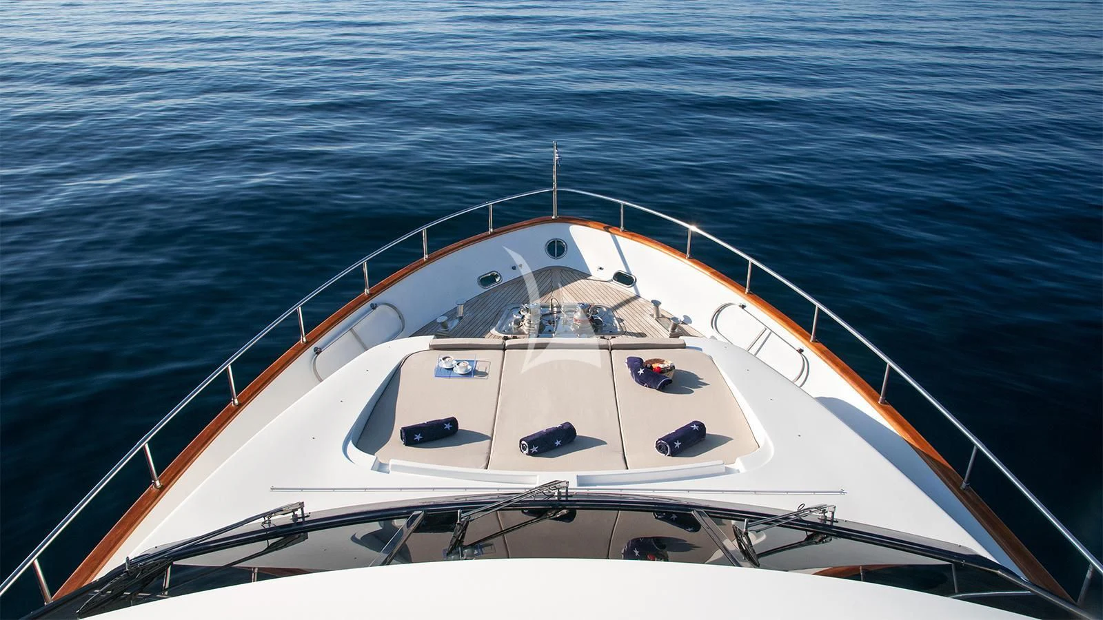 a white boat on the water aboard ACIONNA Yacht for Sale