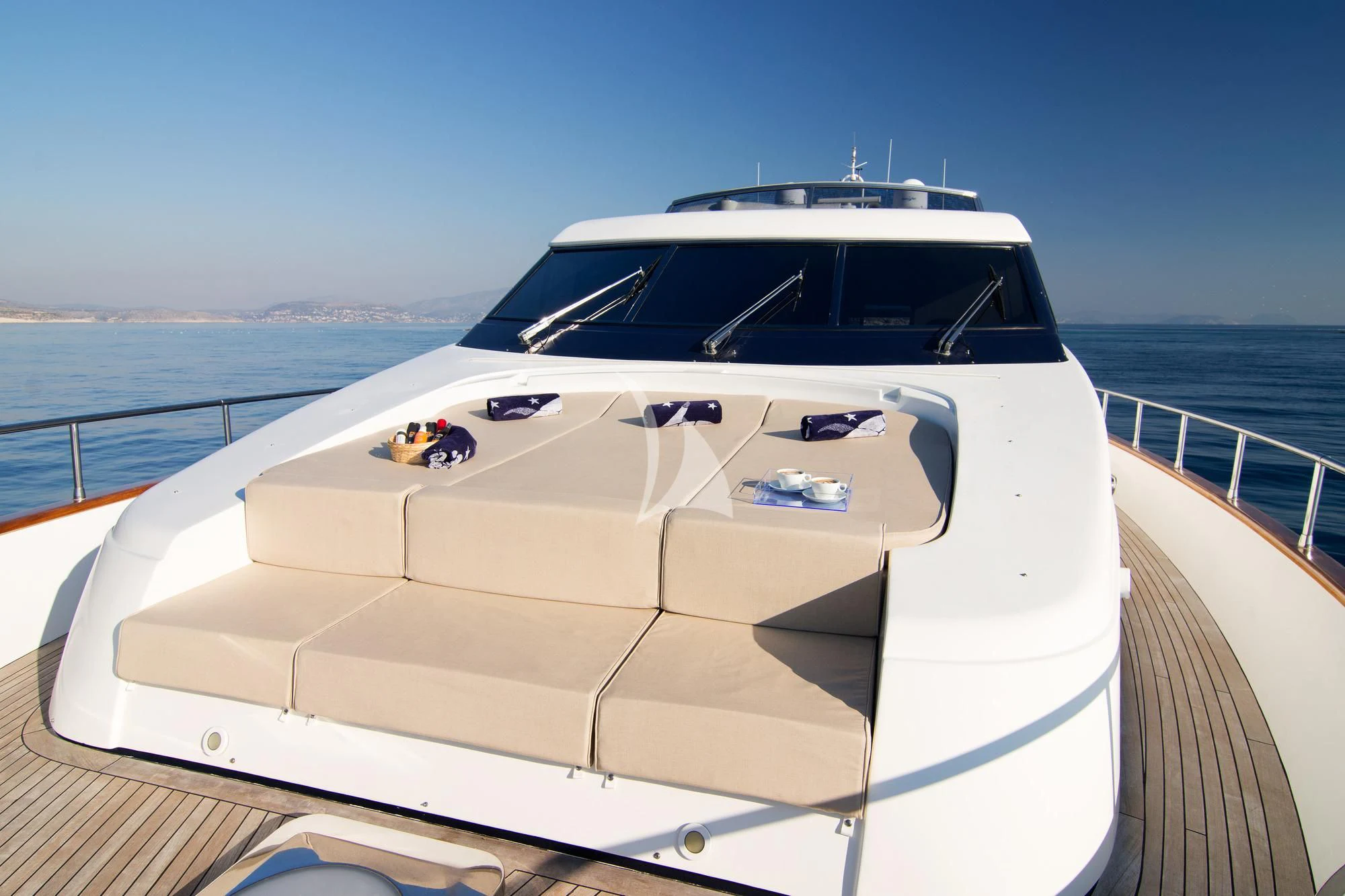 a white yacht on a deck aboard ACIONNA Yacht for Sale