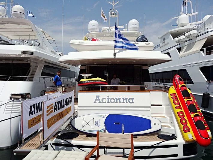 a boat is parked next to a boat aboard ACIONNA Yacht for Sale