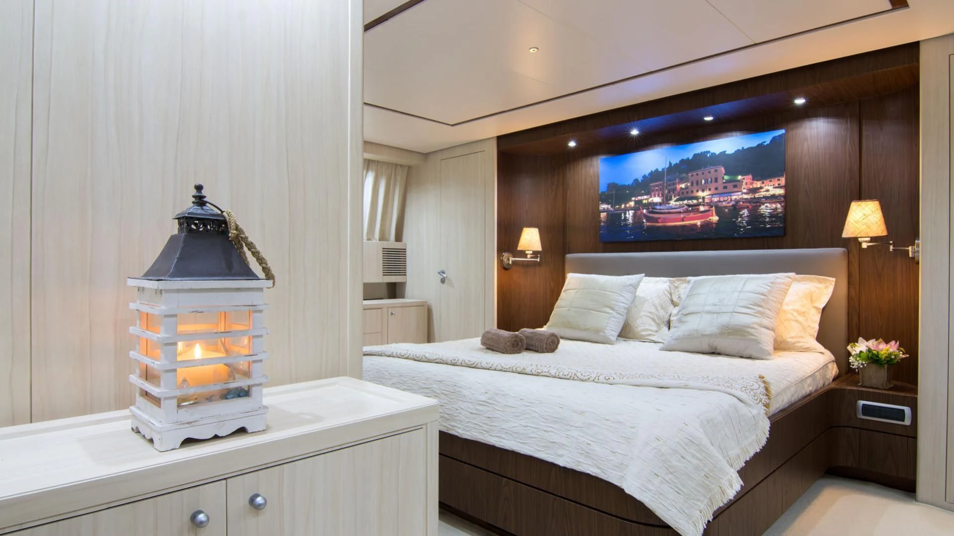 a bed with a large fish tank aboard ACIONNA Yacht for Sale