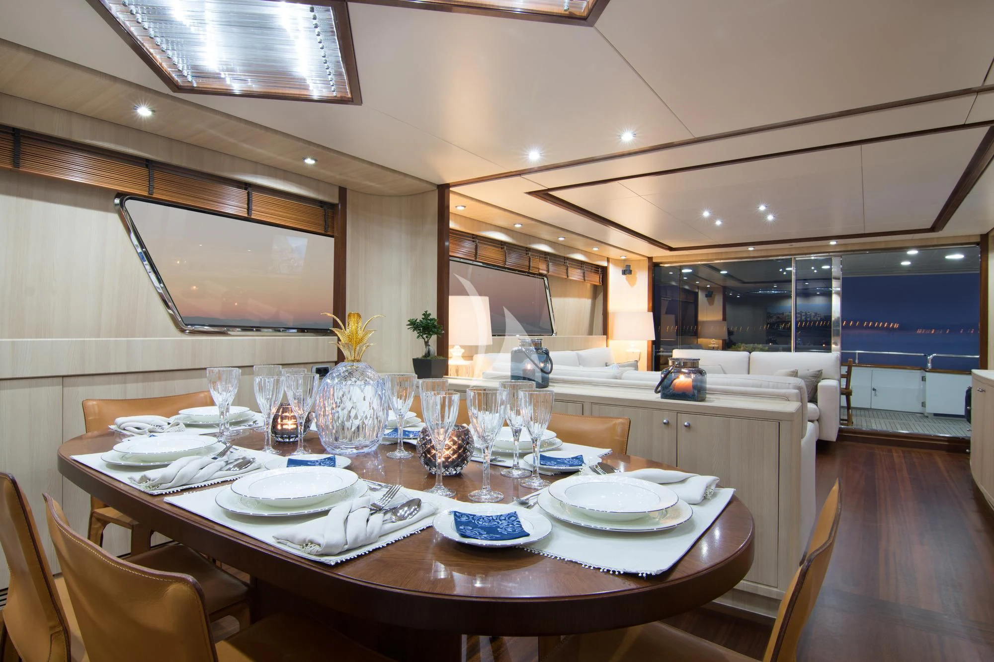 a large kitchen with a table set aboard ACIONNA Yacht for Sale
