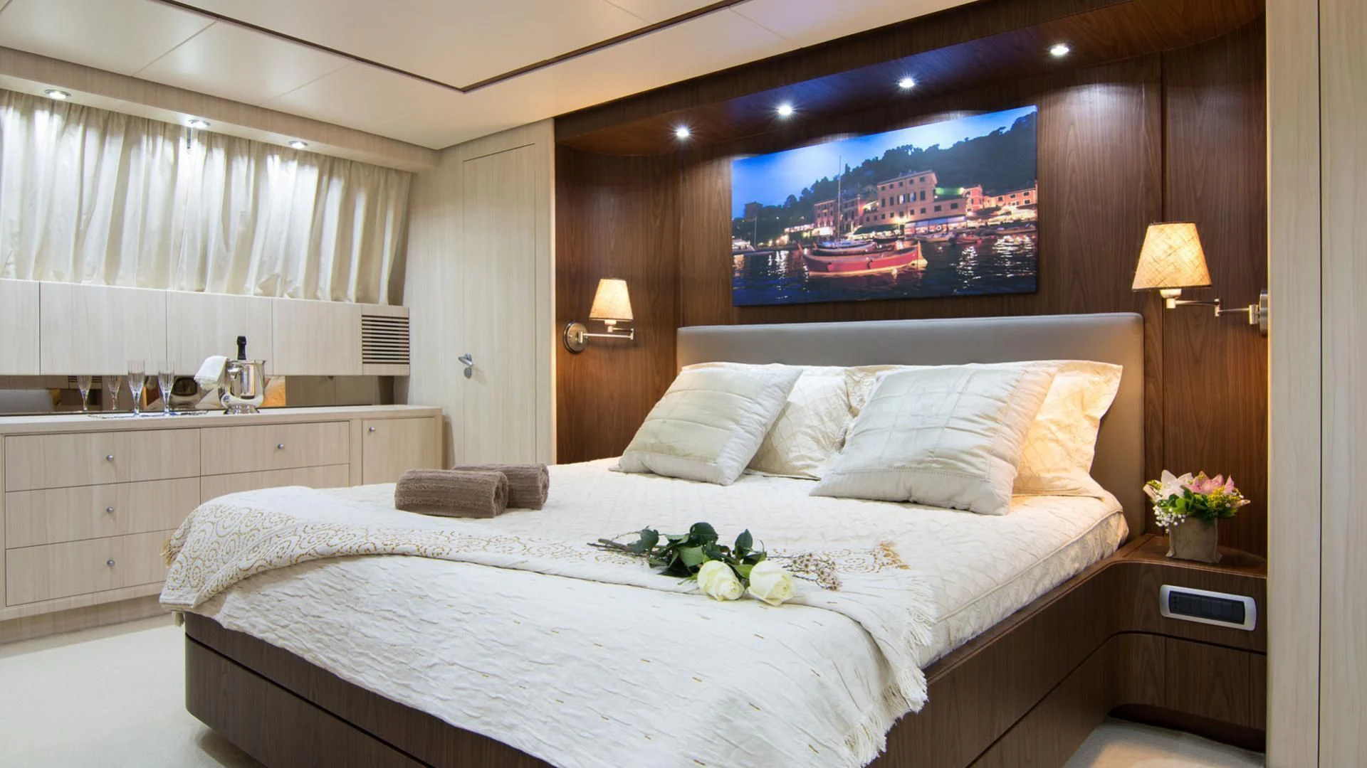 a bed with white sheets and pillows aboard ACIONNA Yacht for Sale