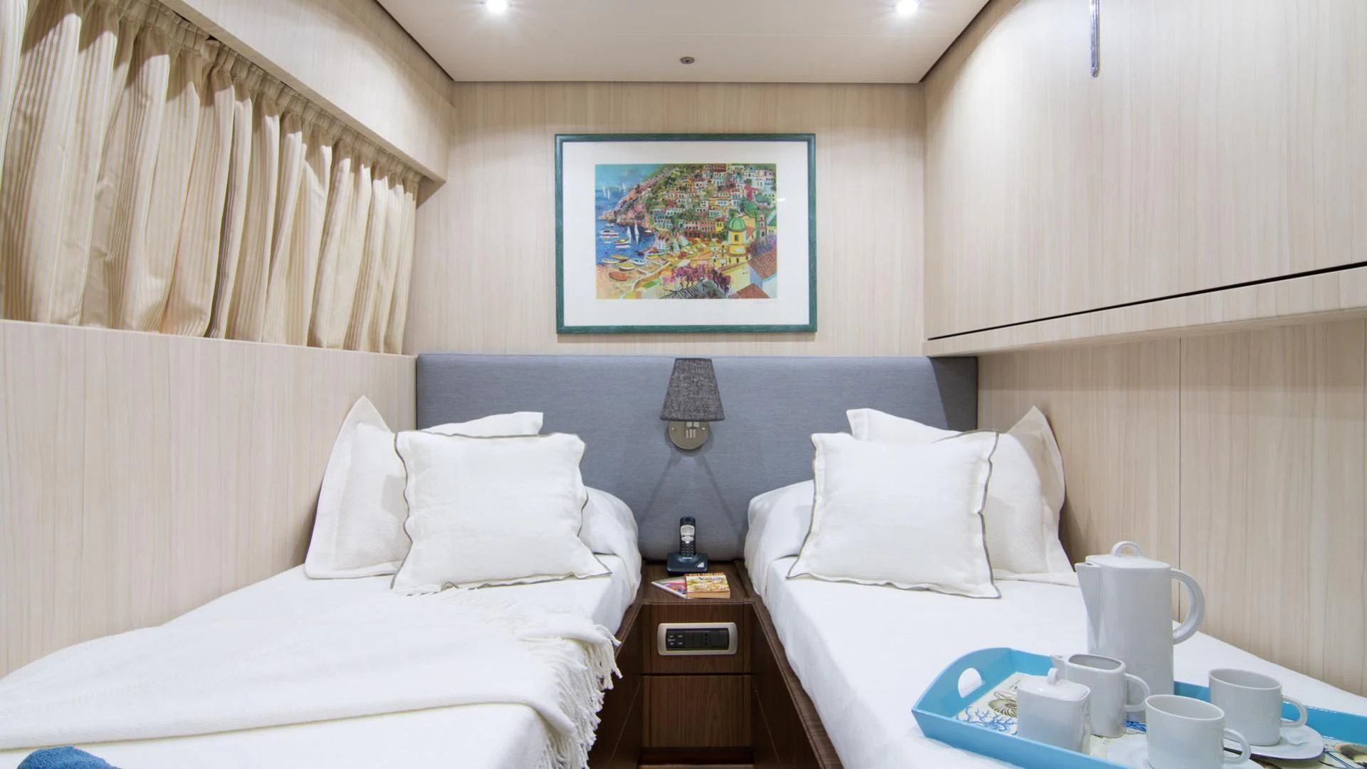 a room with a bed and a table aboard ACIONNA Yacht for Sale