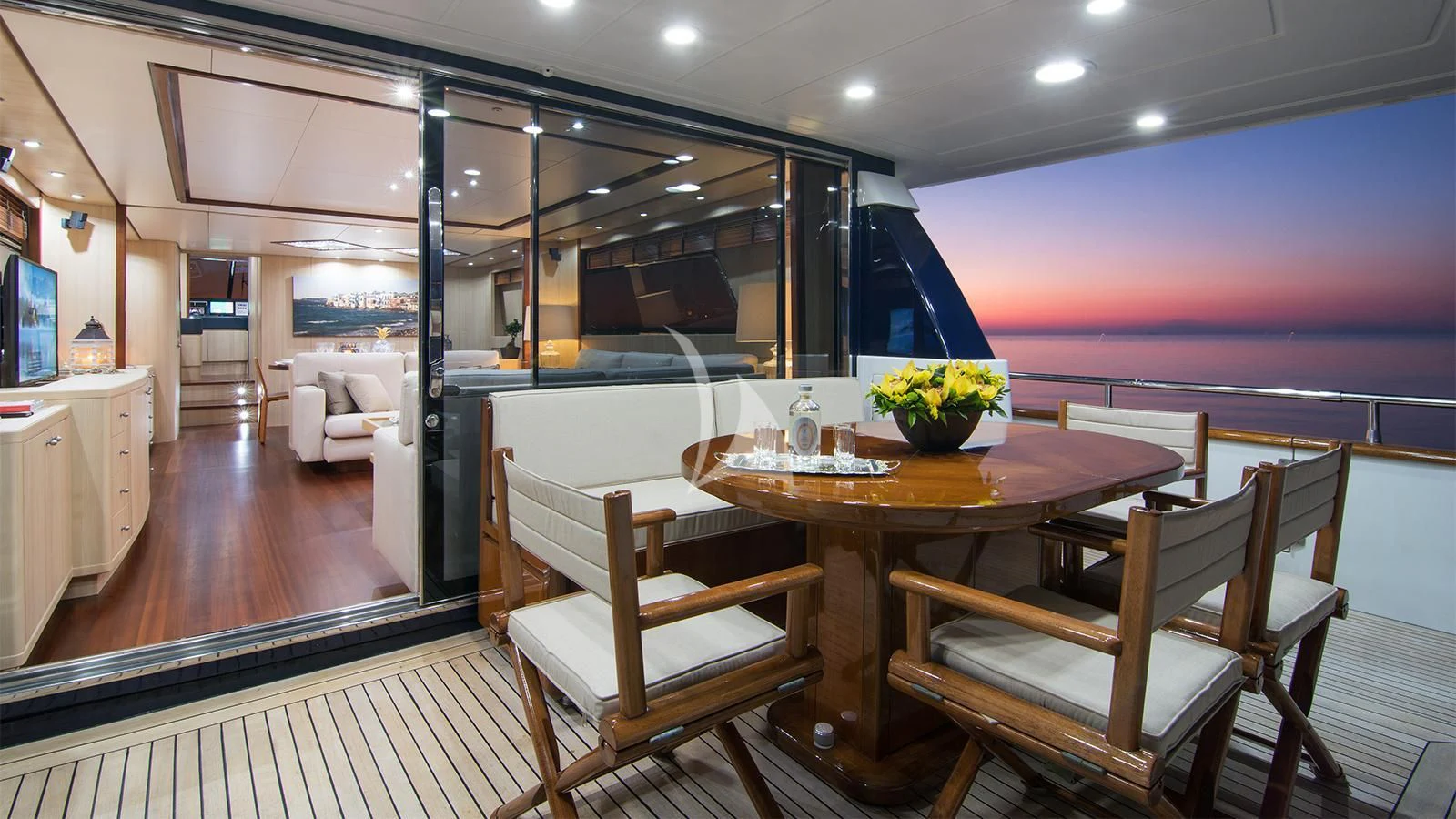 a dining room with a table and chairs aboard ACIONNA Yacht for Sale