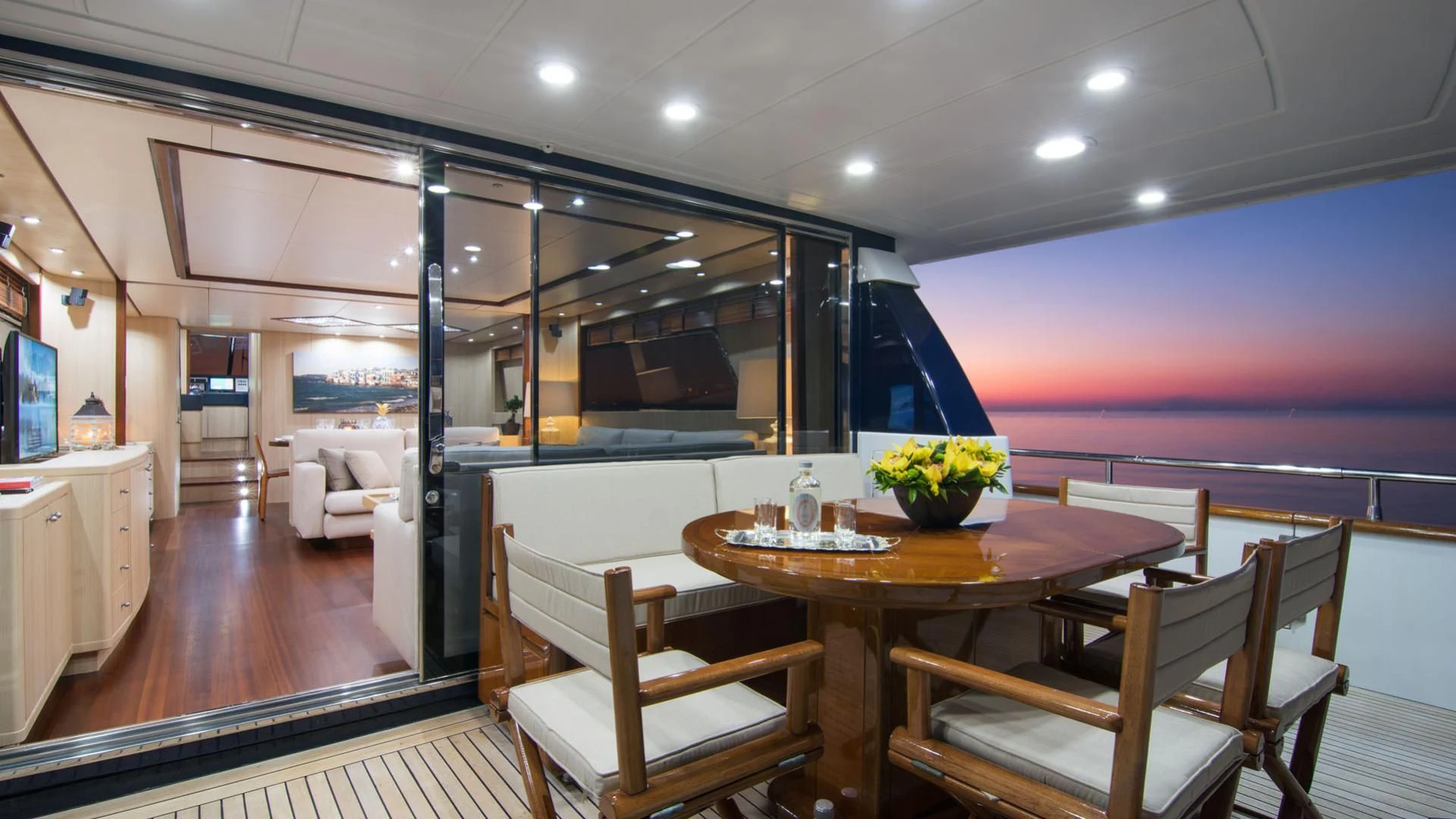 a dining room with a table and chairs aboard ACIONNA Yacht for Sale