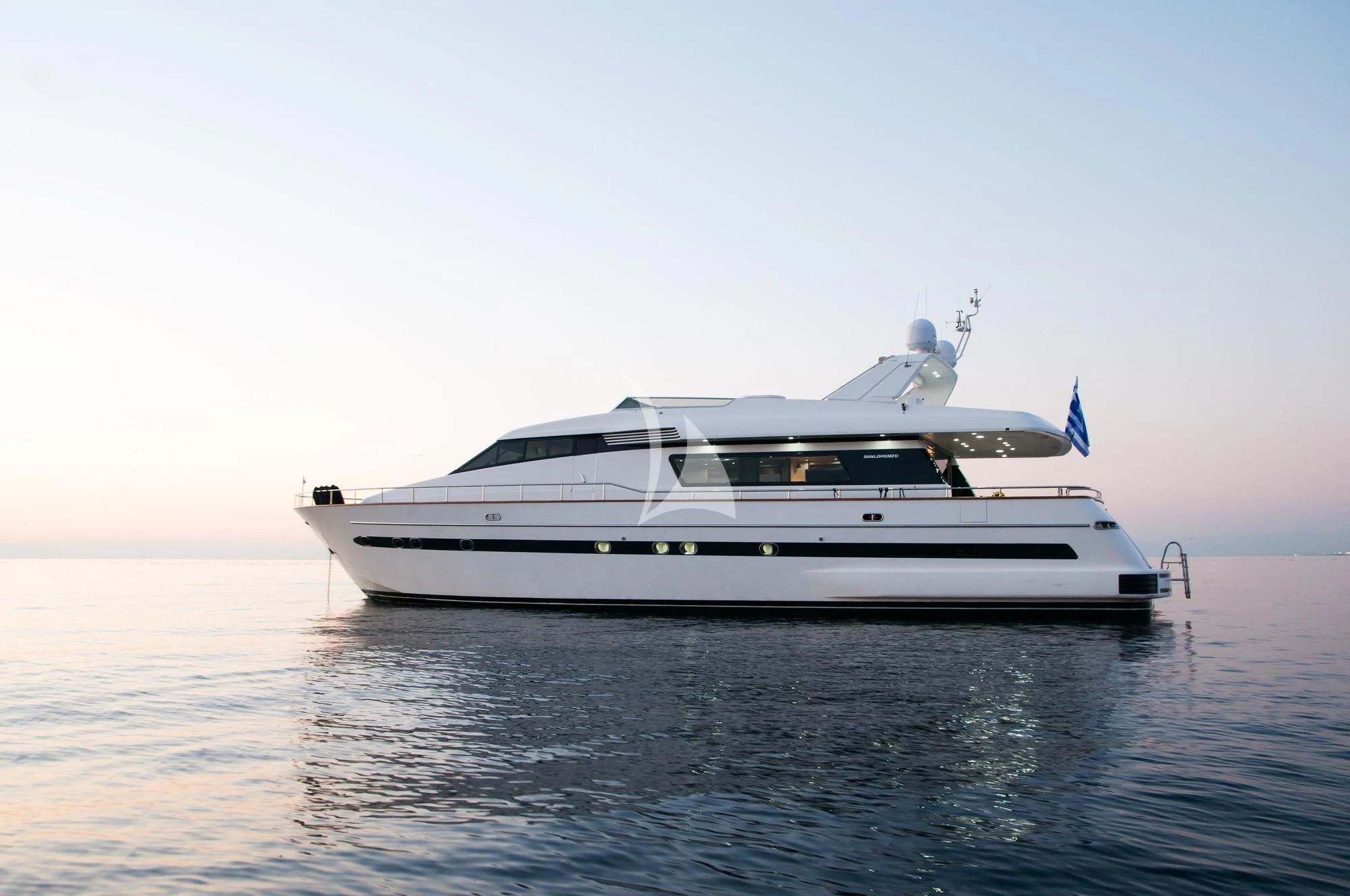 a white yacht on the water aboard ACIONNA Yacht for Sale